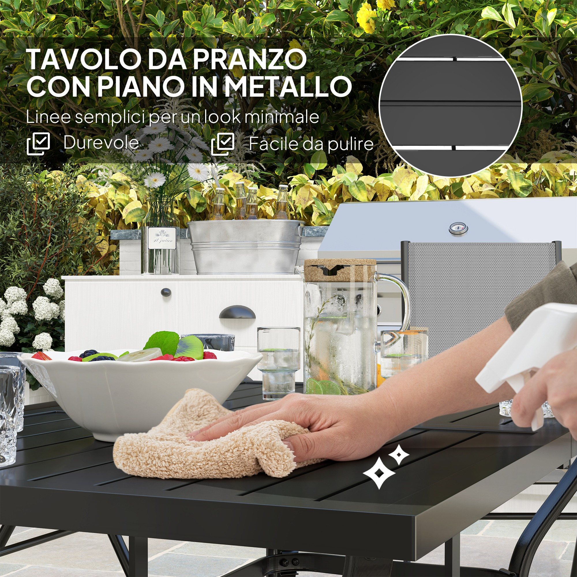 Tavolo da pranzo in metallo nero con ciotola di frutta, caraffa in vetro e mano che lo pulisce.