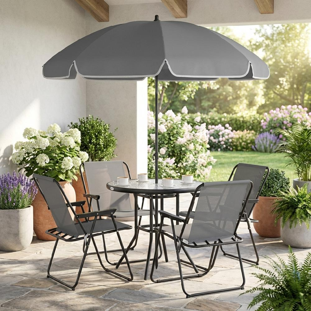 Un tavolo rotondo con quattro sedie sotto un ombrellone, su un patio in pietra.