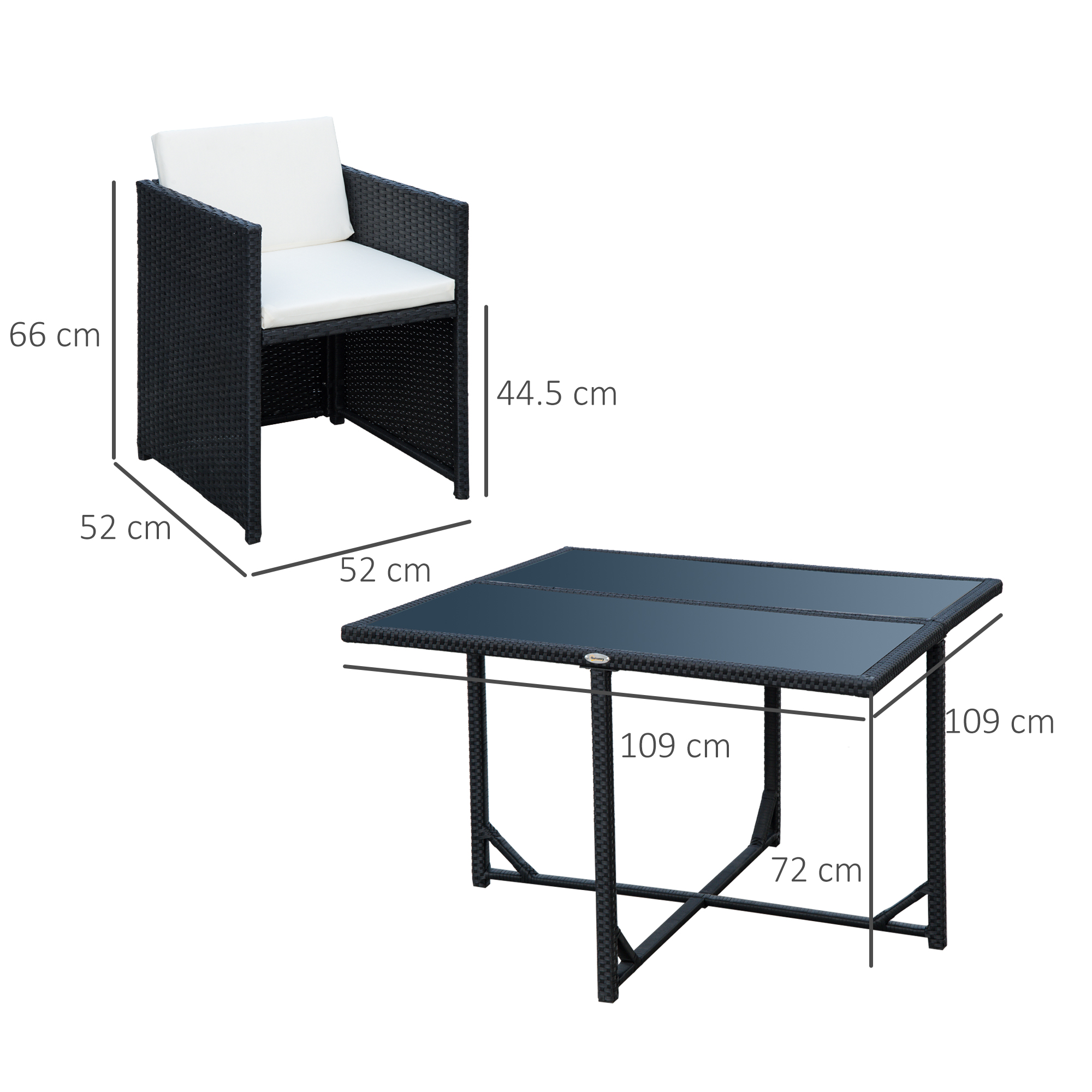 Una poltrona in rattan nero con cuscino bianco e un tavolo rettangolare.
