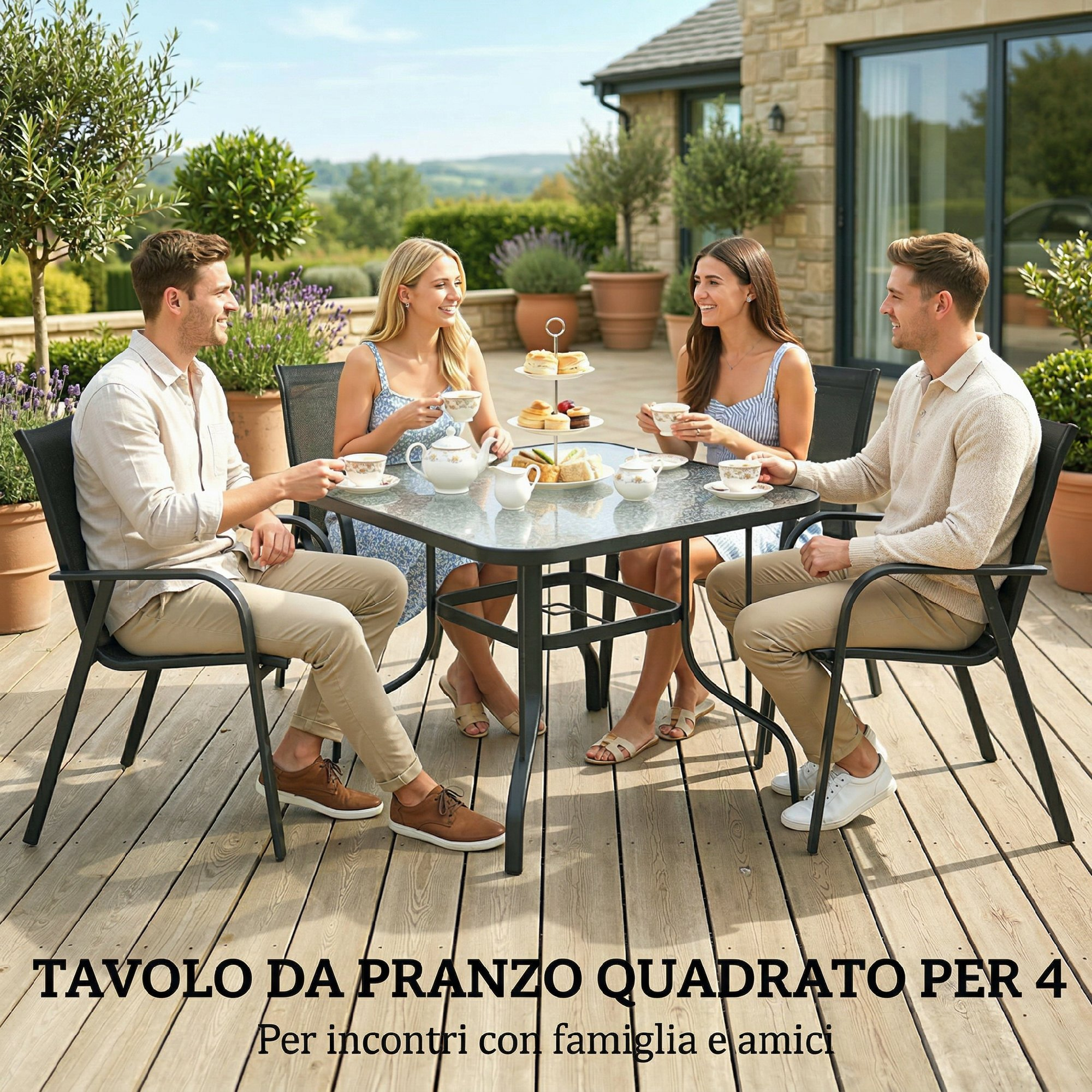 Quattro persone siedono a un tavolo all'aperto per una festa del tè con pasticcini.