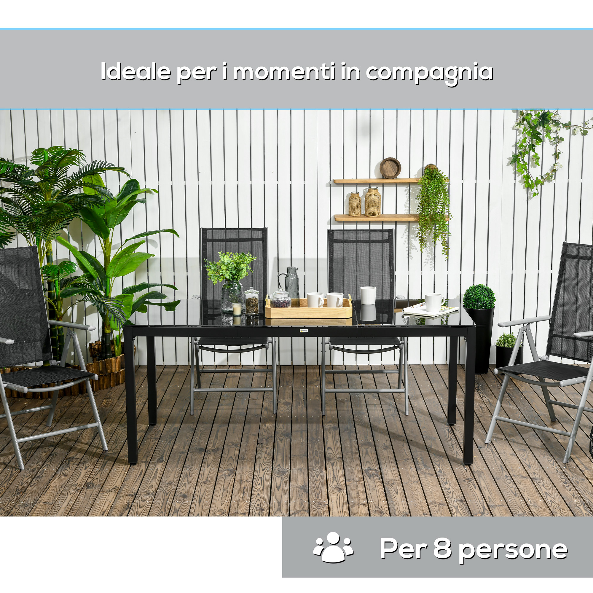 Un tavolo nero in vetro con quattro sedie su un terrazzo di legno.