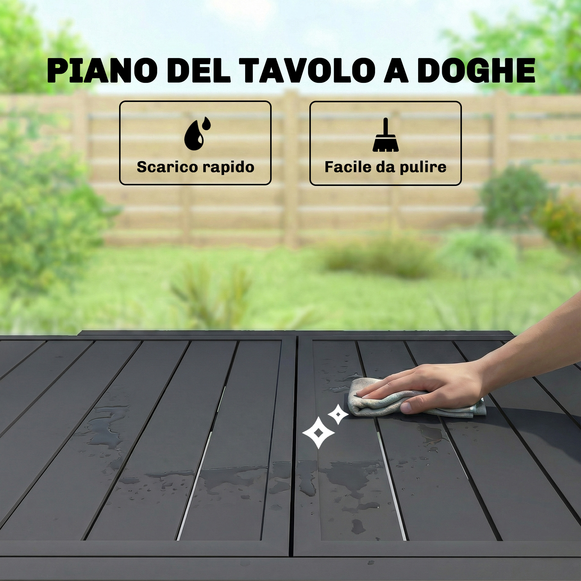 Una mano pulisce un tavolo scuro a doghe all'aperto con un panno.