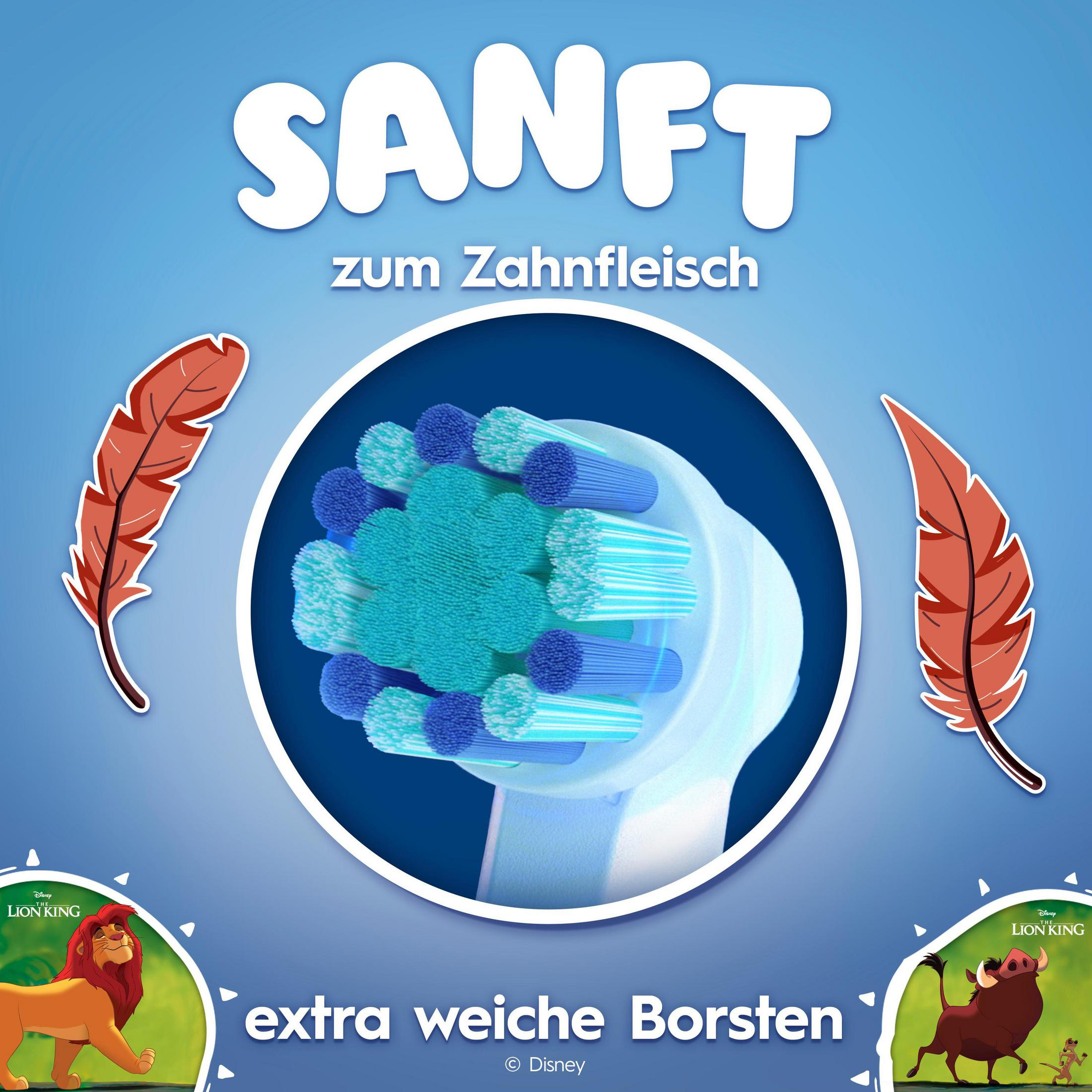 Zahnbrste mit sanften Borsten, umgeben von Federn und der Lwenknig-Figur.