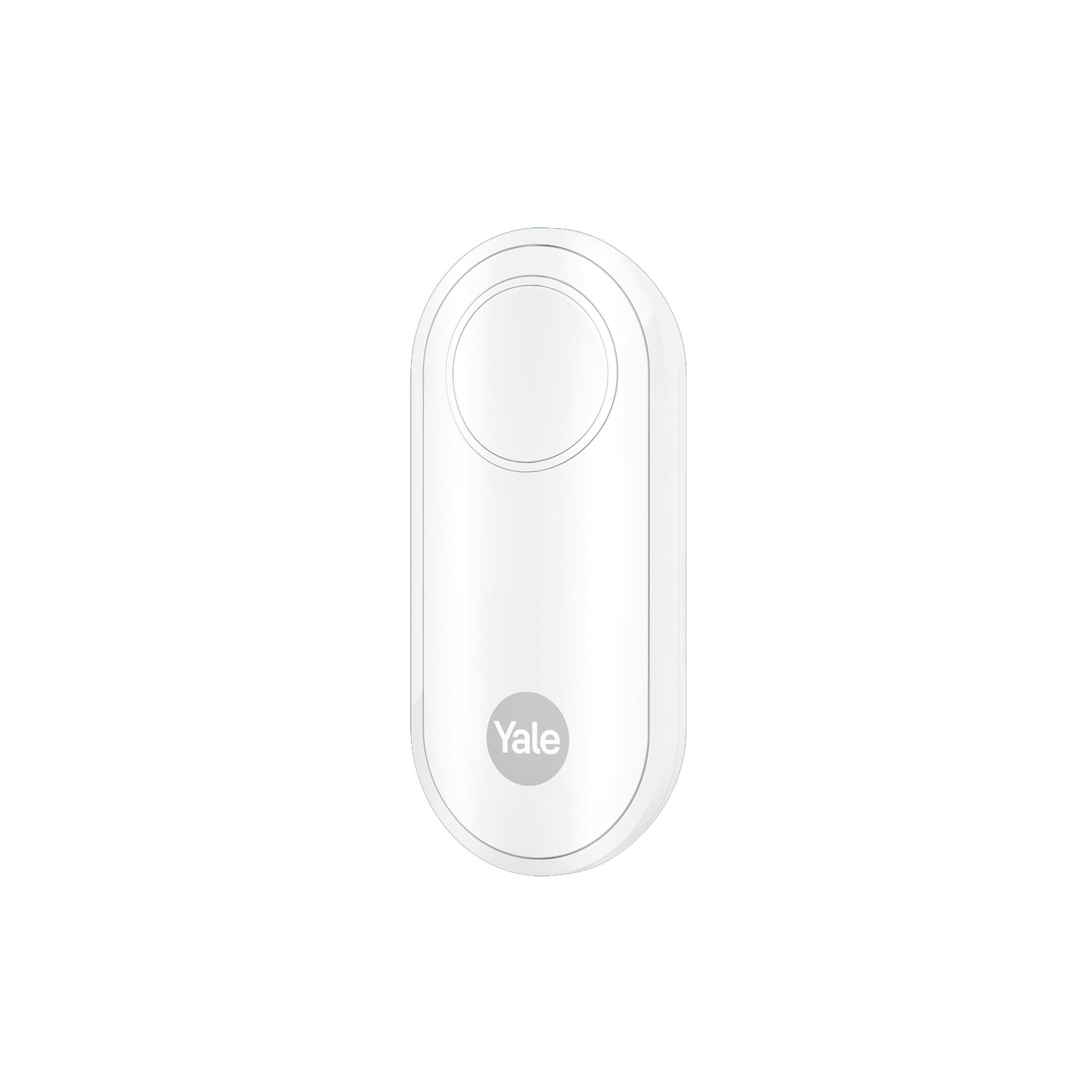 Un accesorio blanco para cerradura de puerta Yale con un botón circular.