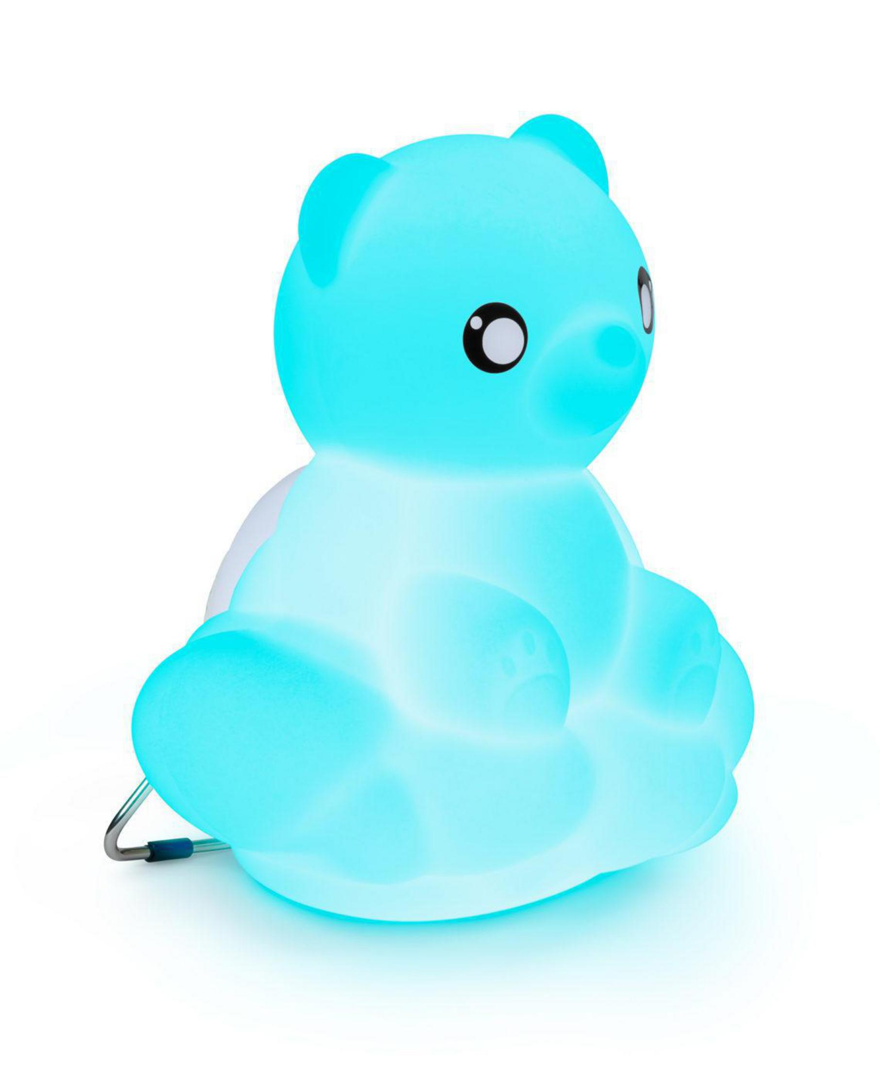 Un ours en peluche bleu lumineux est assis sur un nuage.