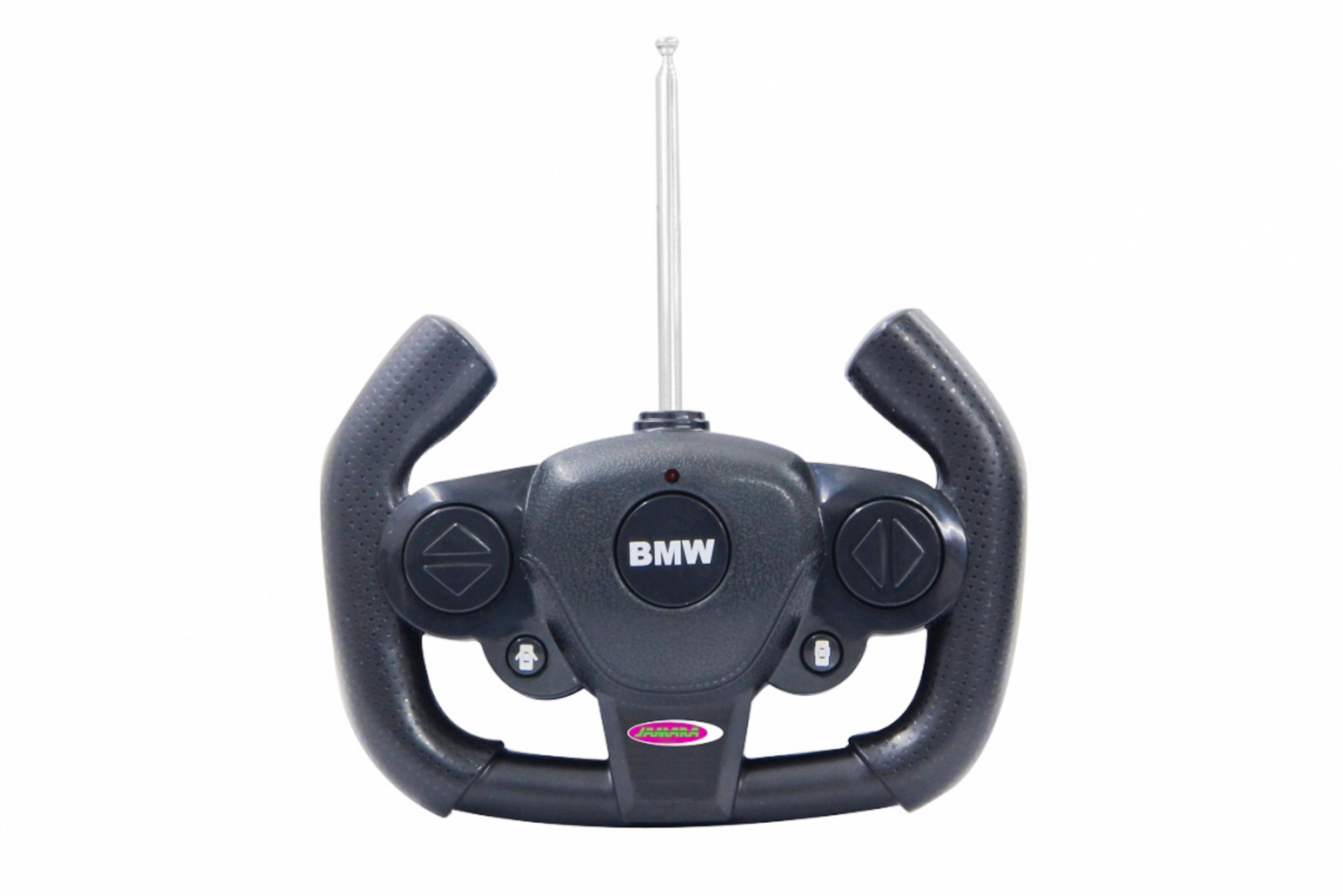 Ein grauer BMW-Fernsteuerungs-Controller mit Antenne, Knöpfen und Lenkrad.