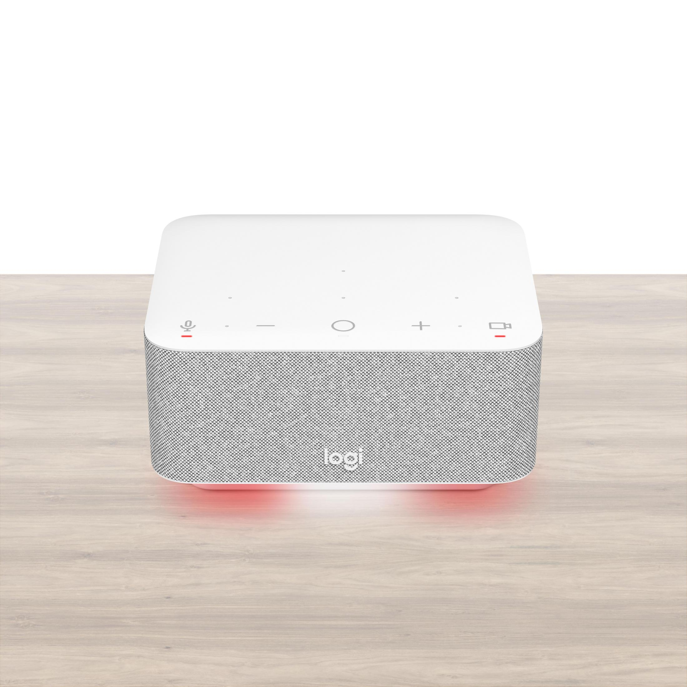 Un altoparlante bianco con copertura in tessuto grigio e luce rossa in basso.