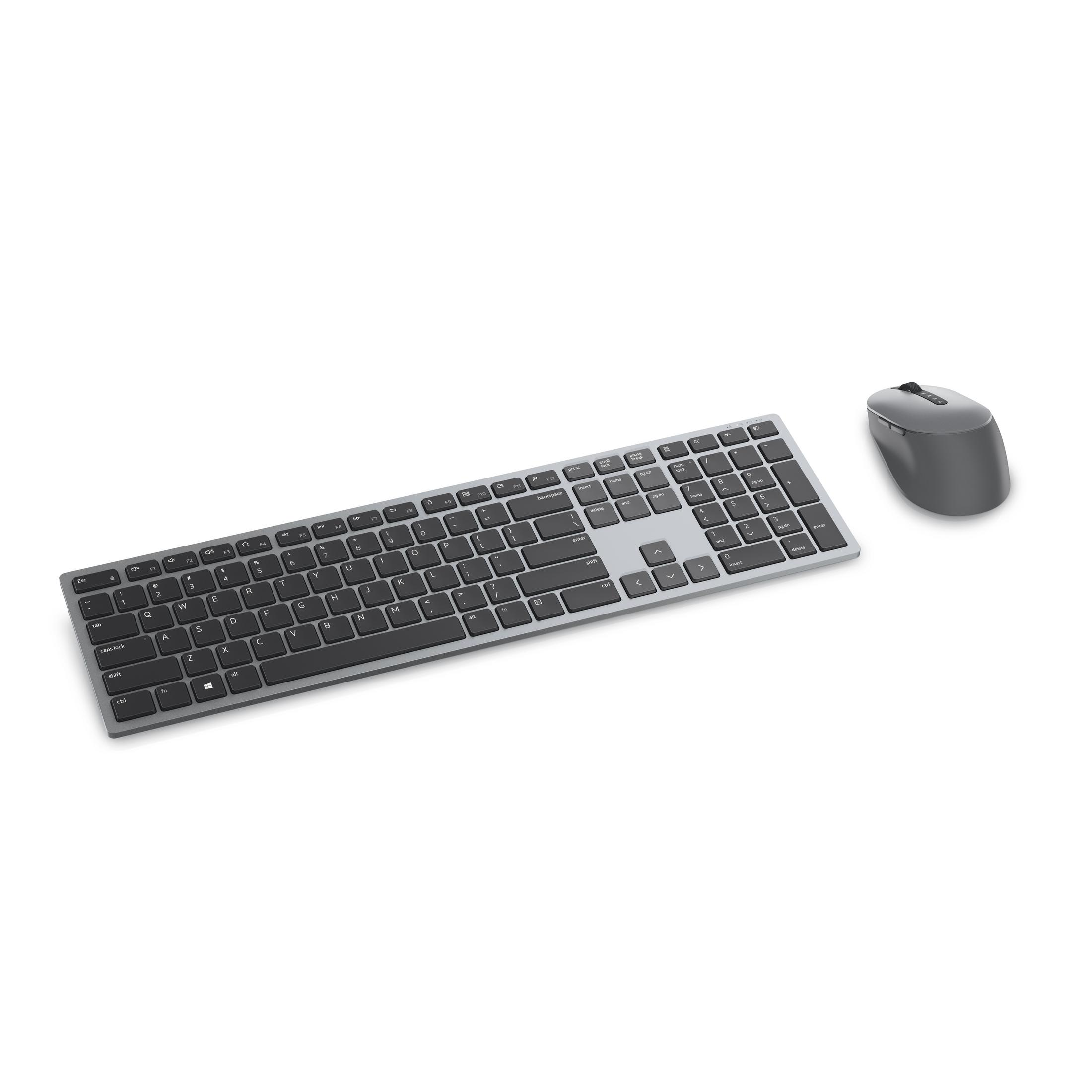 Graue kabellose Tastatur und Maus auf weißem Hintergrund.