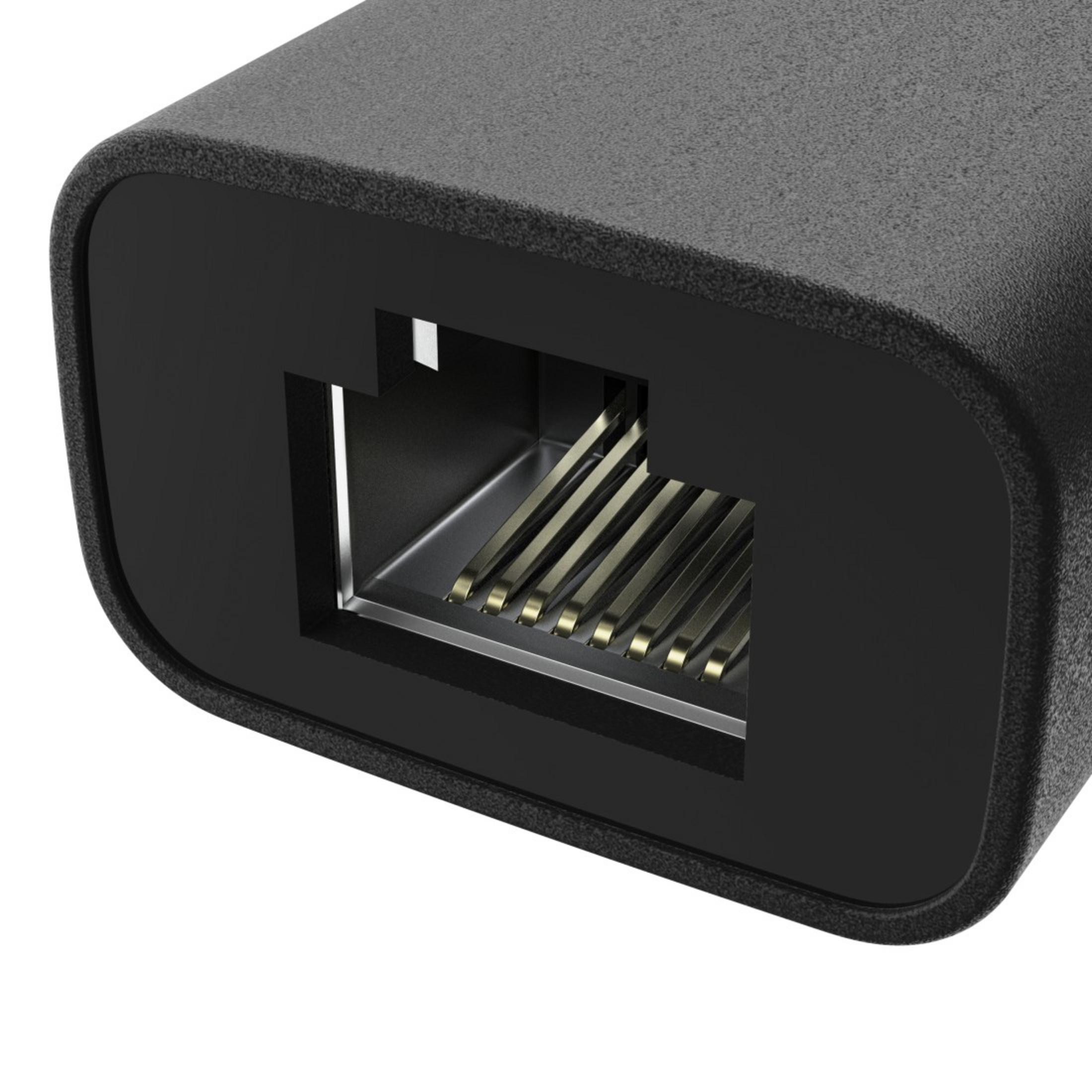 Primo piano di un adattatore nero con contatti dorati visibili in una porta.