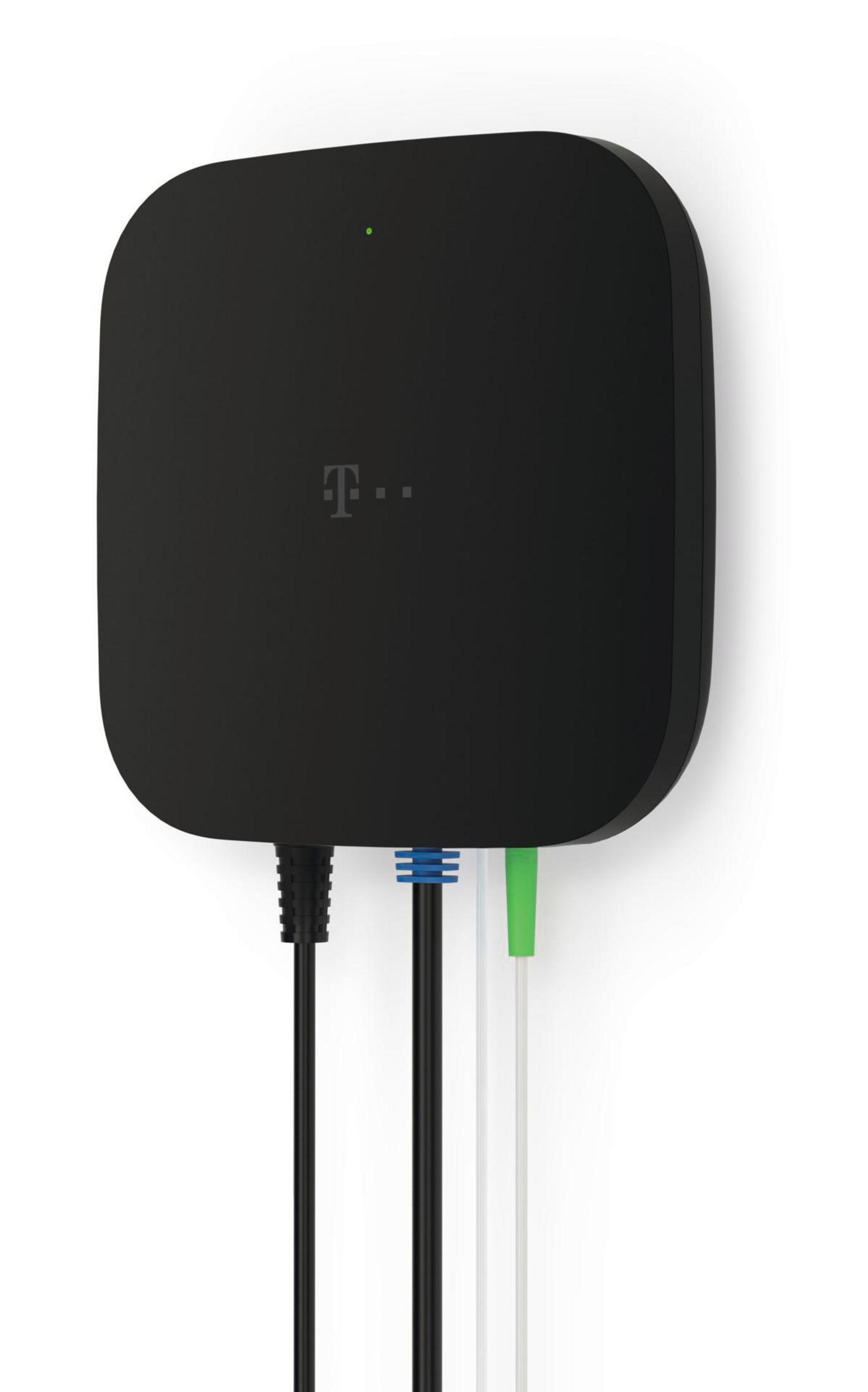 A black T-Mobile device on a wall with three cables.