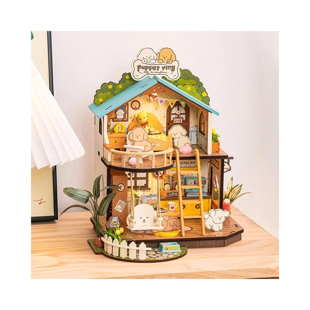 Ein Puppenhaus mit süßen Welpen-Figuren, Möbeln und Zubehör auf einer Holzoberfläche.
