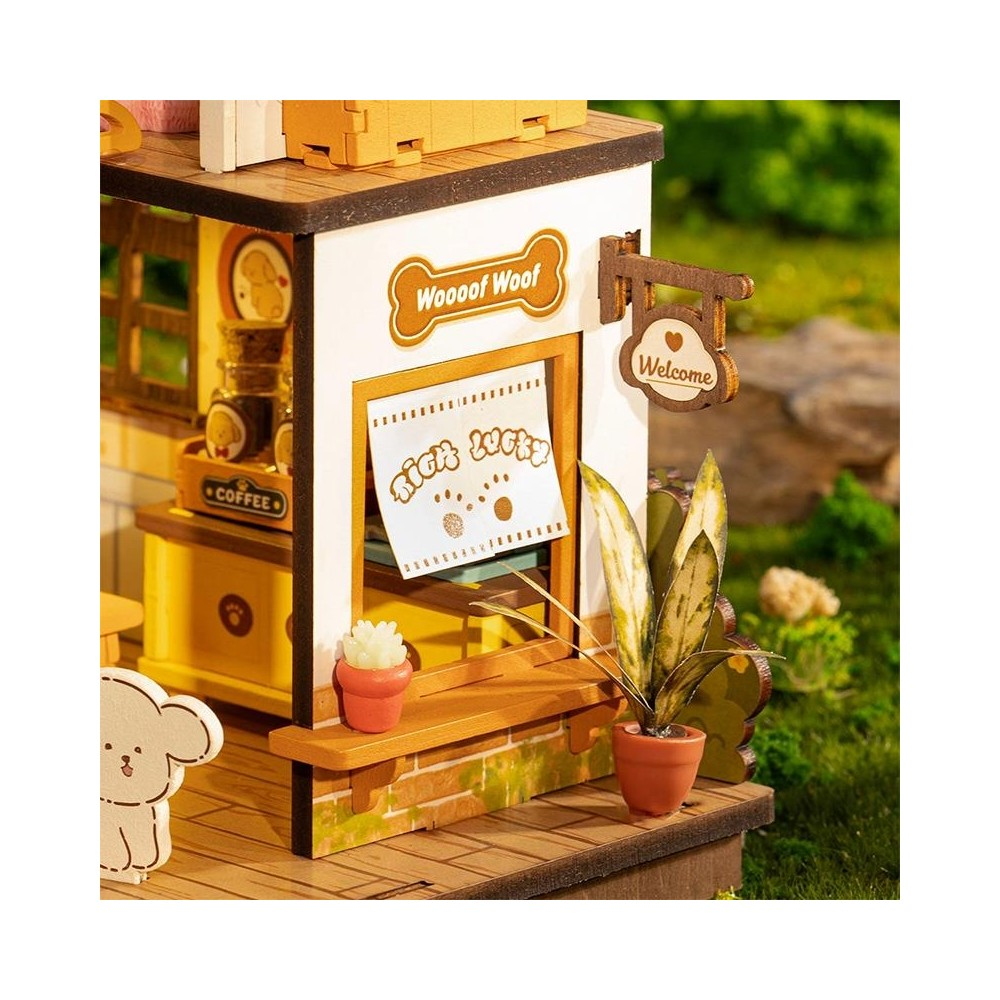 Miniatur-Hundecafe mit Schildern 'Woooof Woof' und 'Welcome'.