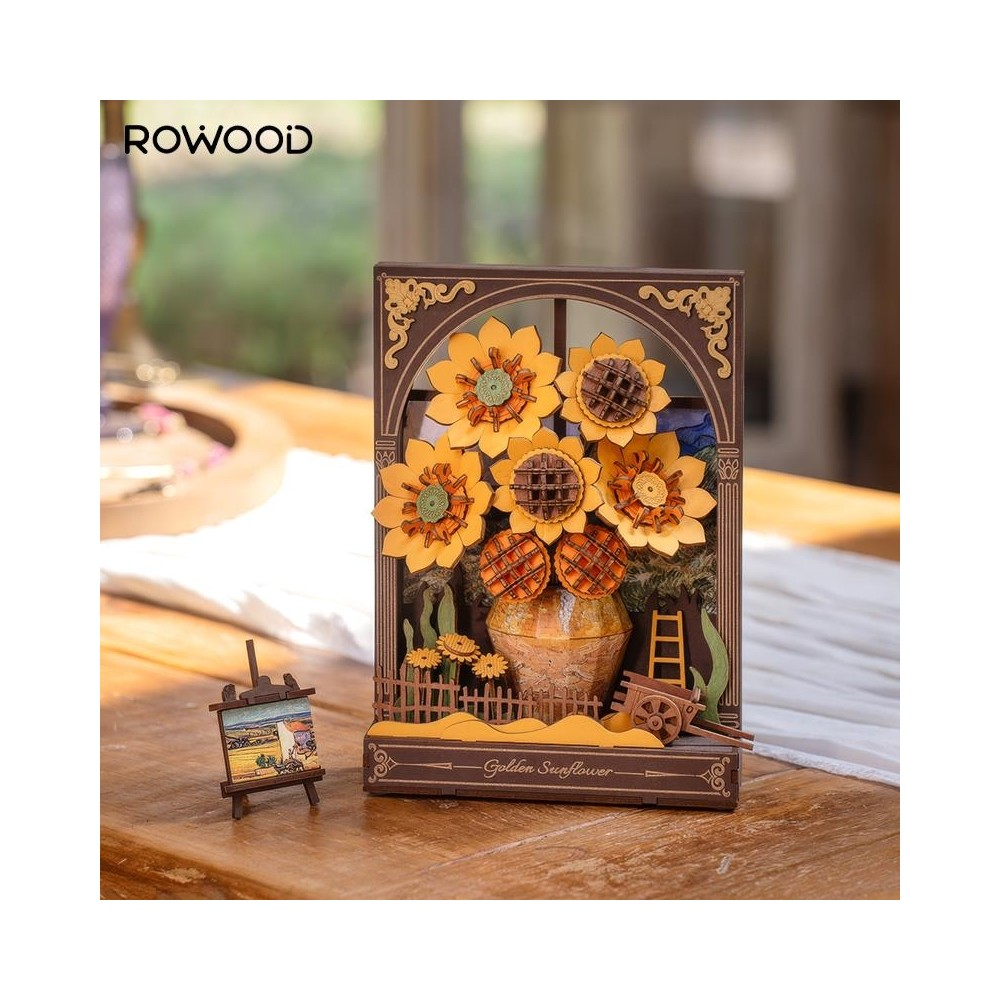Modèle en bois de tournesols dans un vase, avec une échelle et une charrette.
