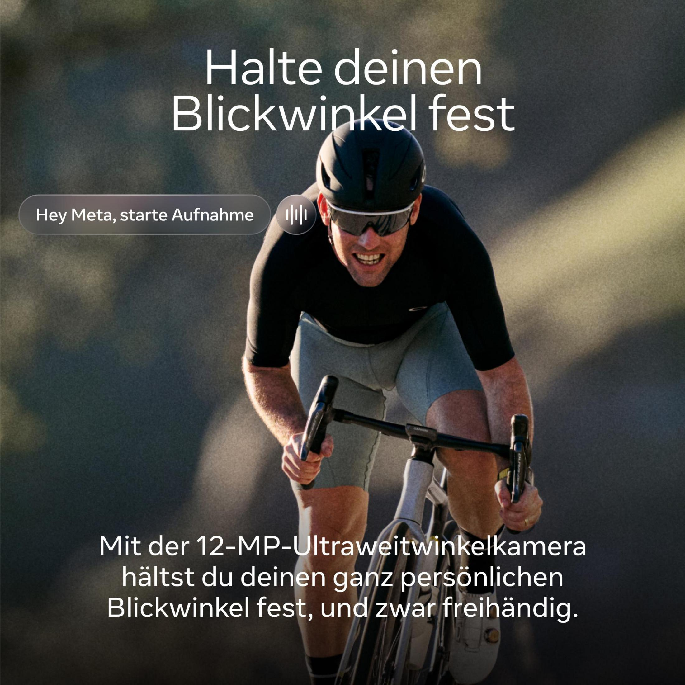 Ein Radfahrer in Schwarz und Grau fährt mit Helm und Brille.