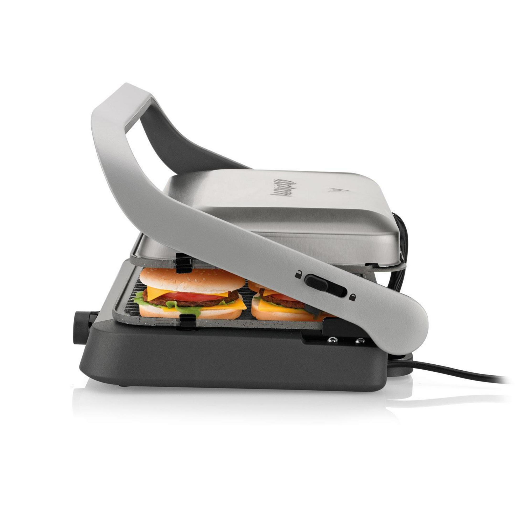 Ein geöffneter Kontaktgrill mit zwei Burgern auf den Heizplatten.