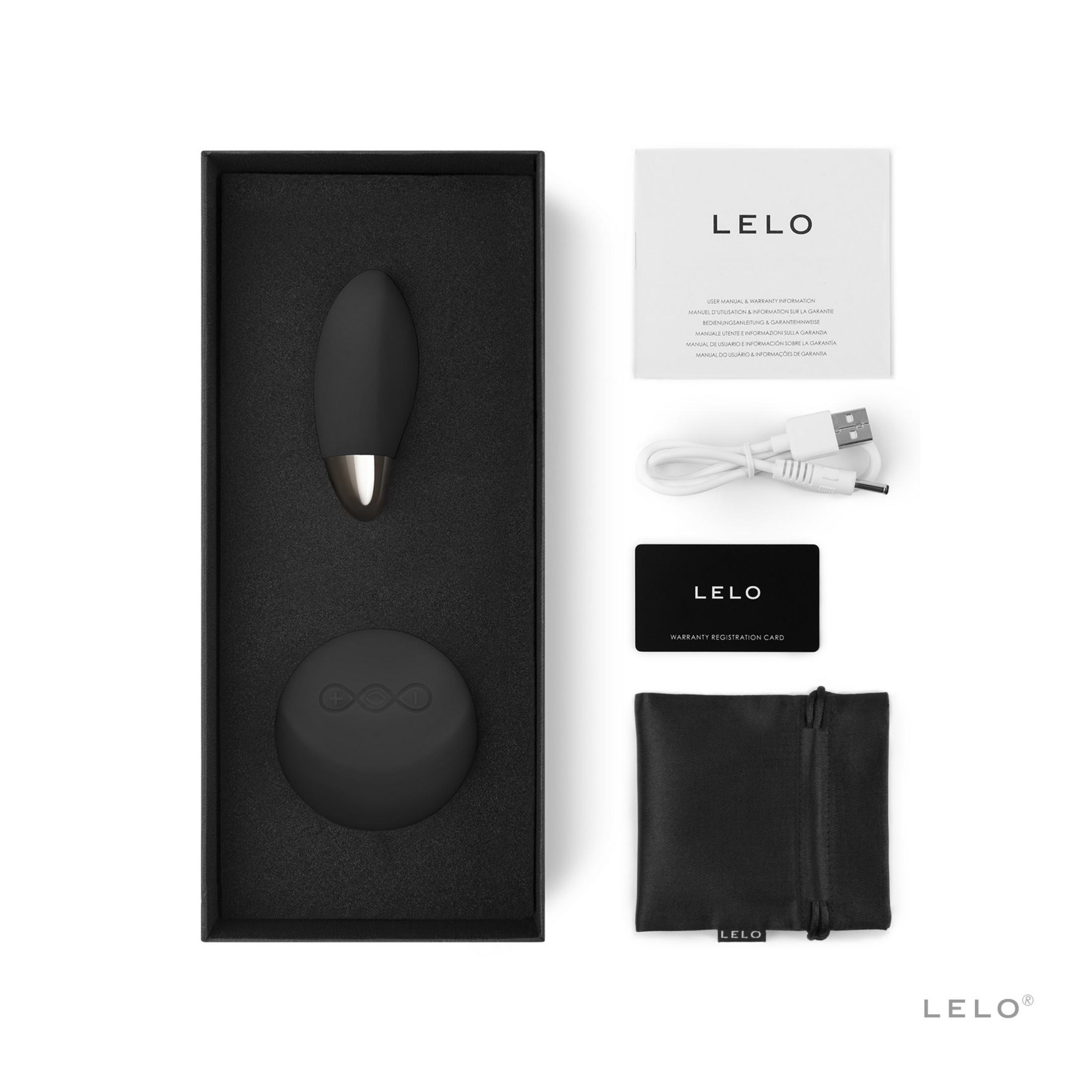 Una caja negra con un producto LELO, cable de carga, manual y tarjeta.