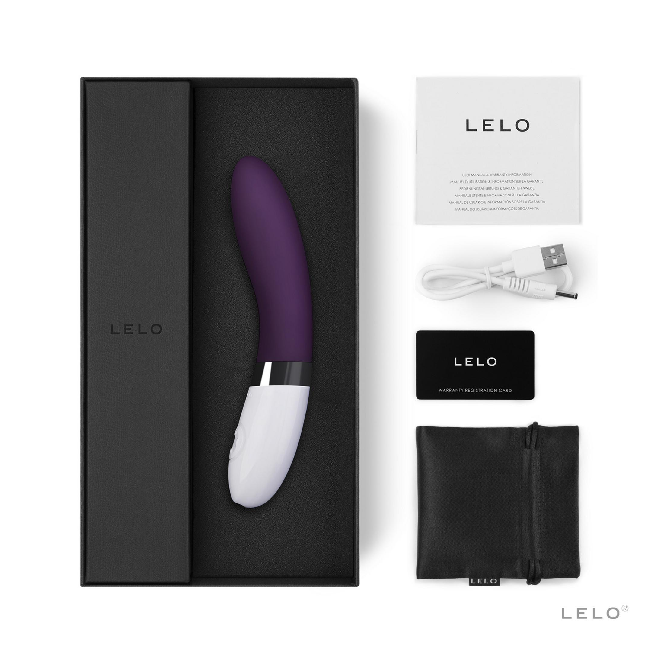 Ein violetter LELO-Vibrator in einer schwarzen Box mit Zubehör.