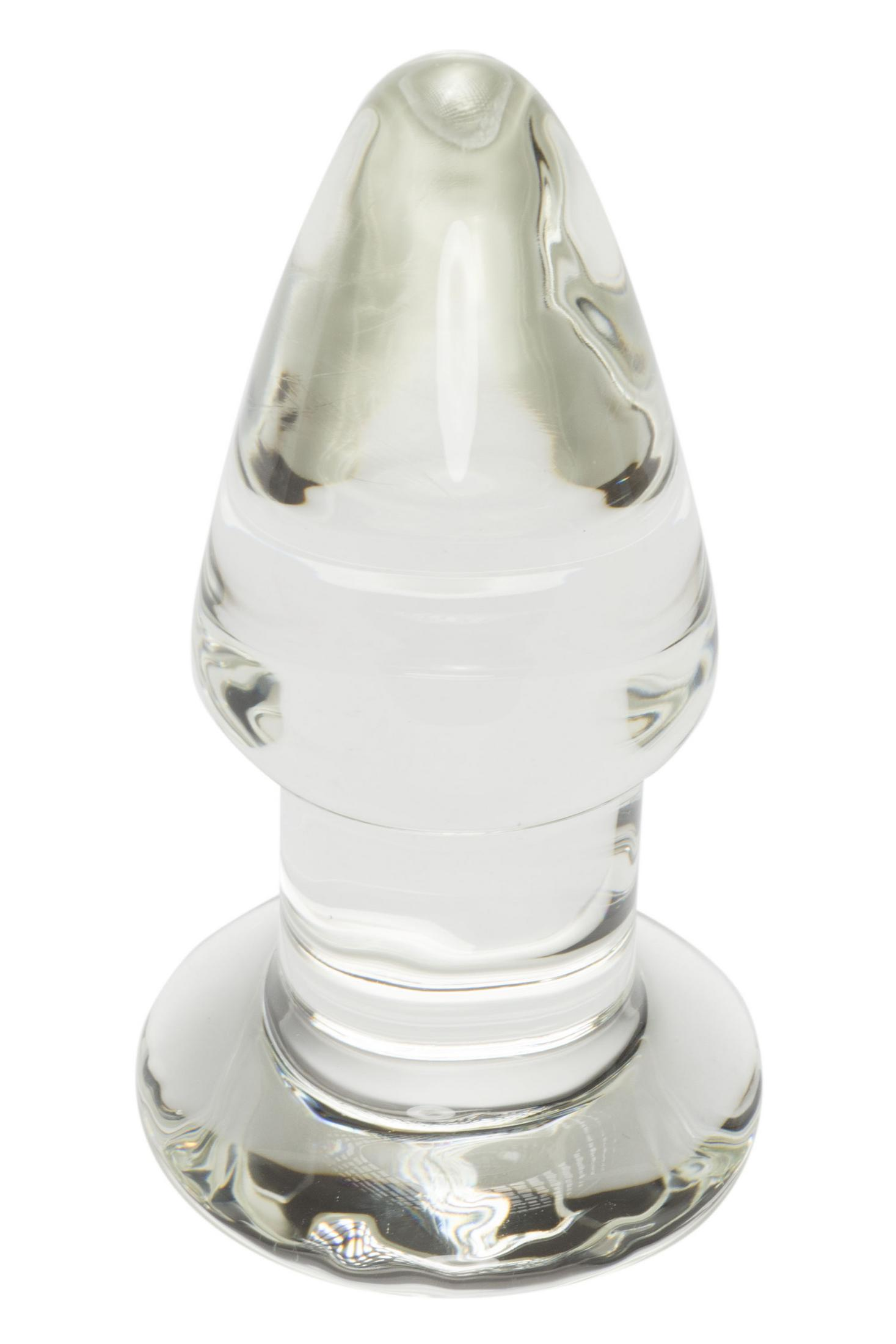 Ein klarer Glas-Plug mit einer breiten Basis und einem konischen Ende.