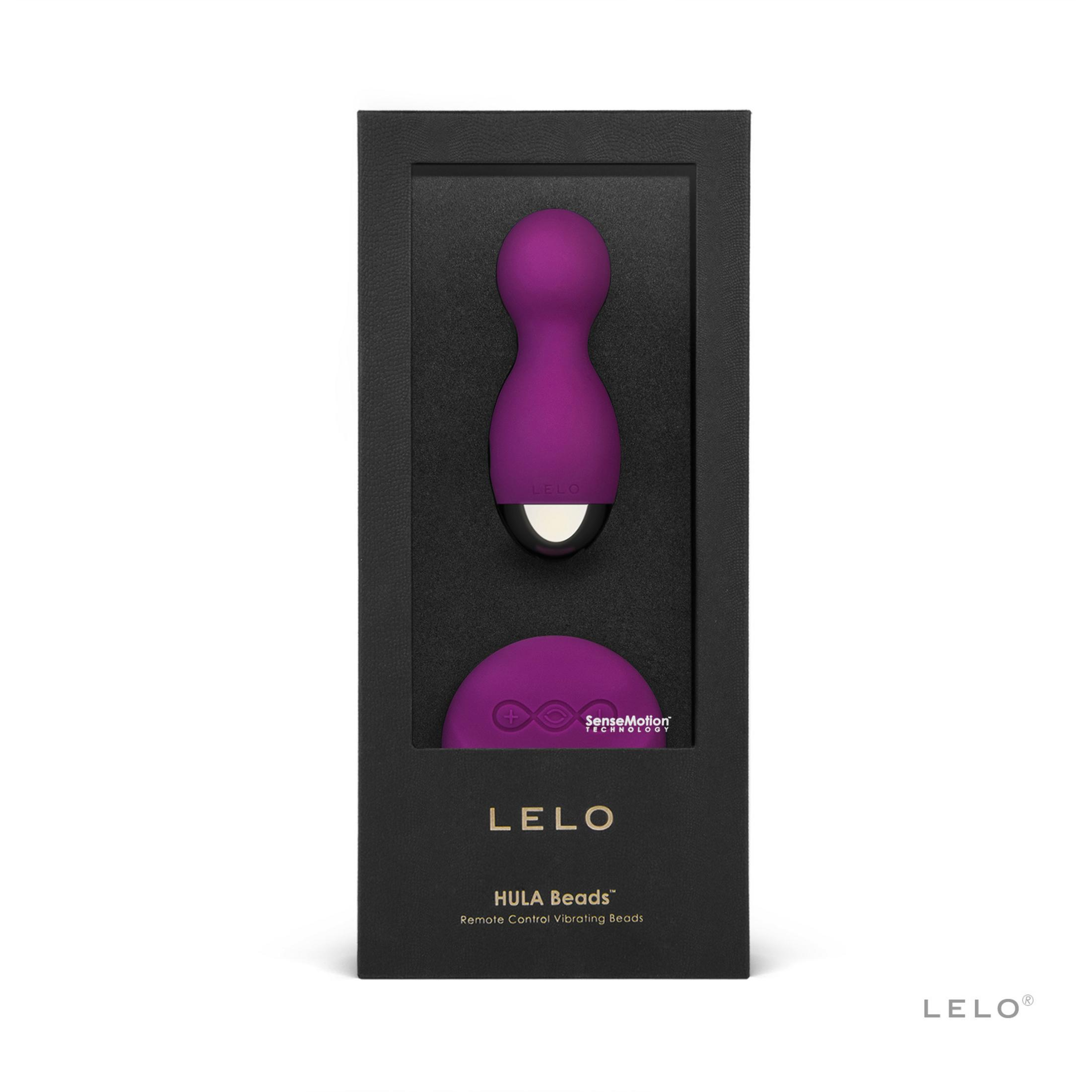 Un juego morado de cuentas vibratorias LELO HULA Beads con control remoto en caja negra.