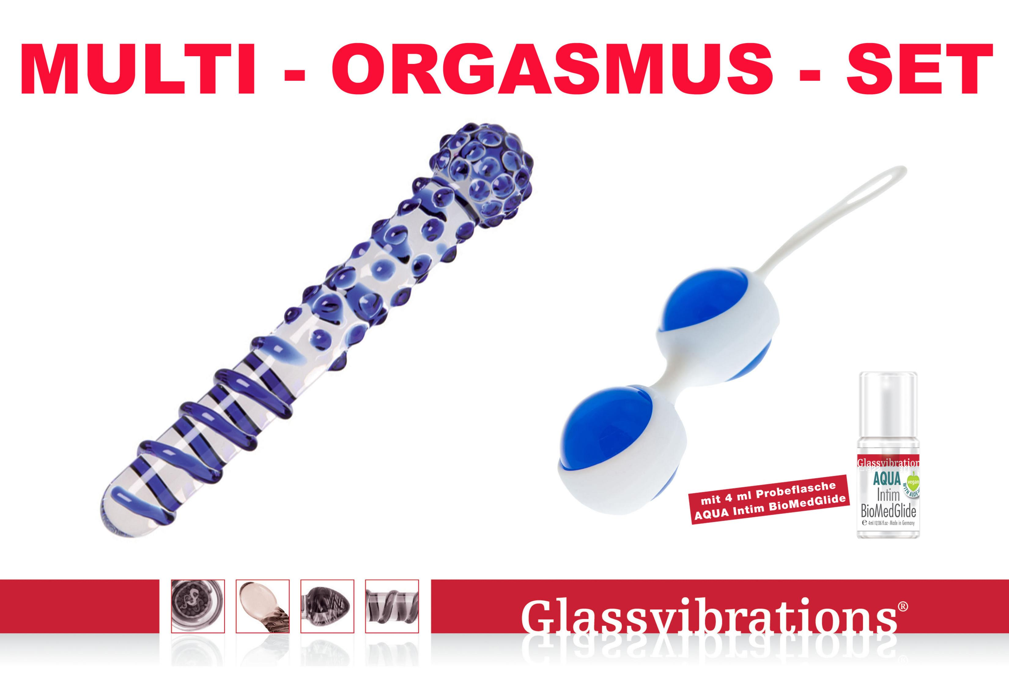 Ein Glas-Dildo, blaue Kugeln und eine Gleitmittelprobe sind auf weißem Hintergrund.