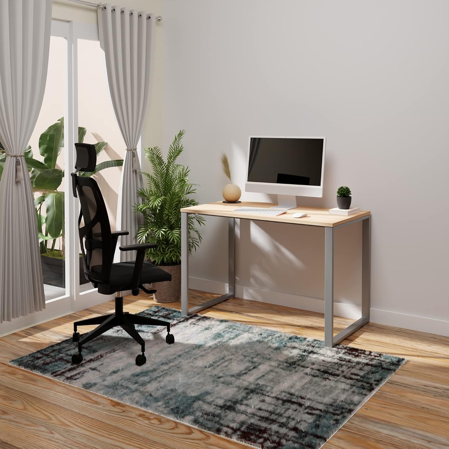Una oficina moderna con escritorio, silla, monitor de computadora y alfombra.