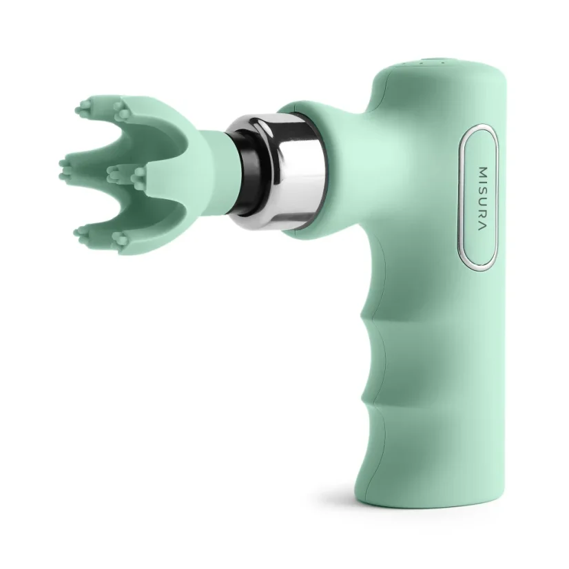 Una pistola de masaje verde menta con cabeza redondeada y mango ergonómico.
