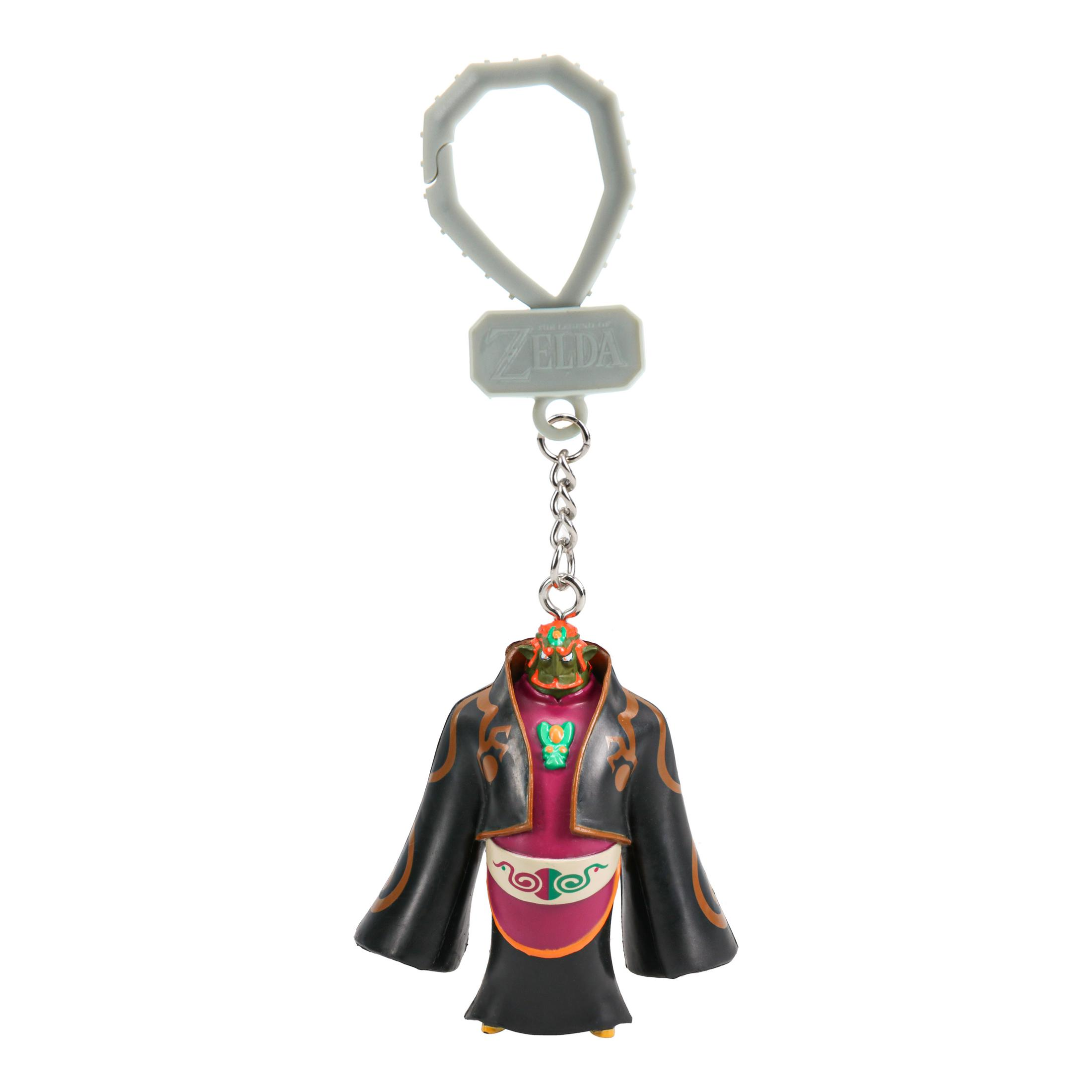 Ein Zelda-Schlüsselanhänger mit einer Figur in einem schwarzen Umhang und lila Gewand.