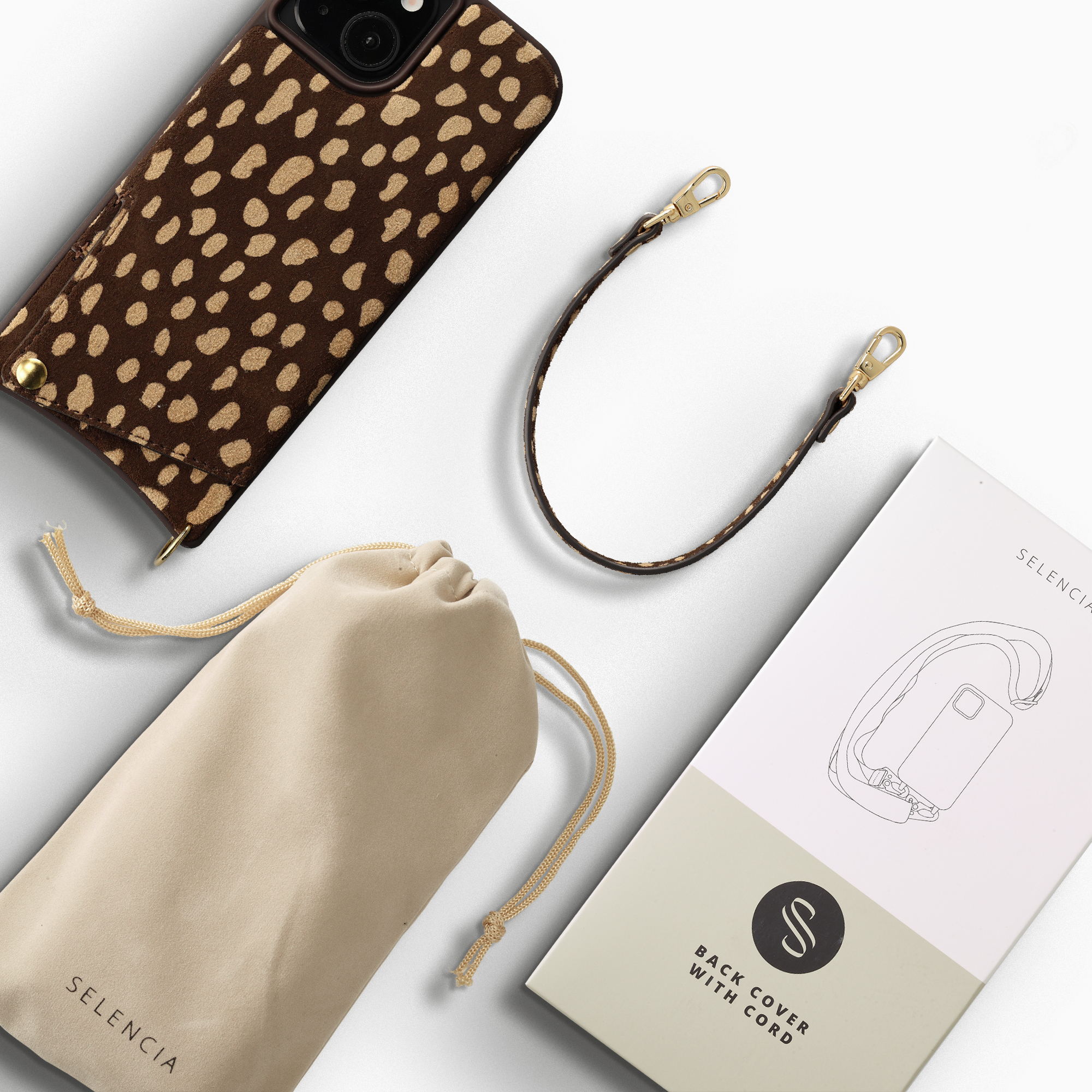 Brown leopard print phone case, beige pouch, and brown strap with gold clasps.