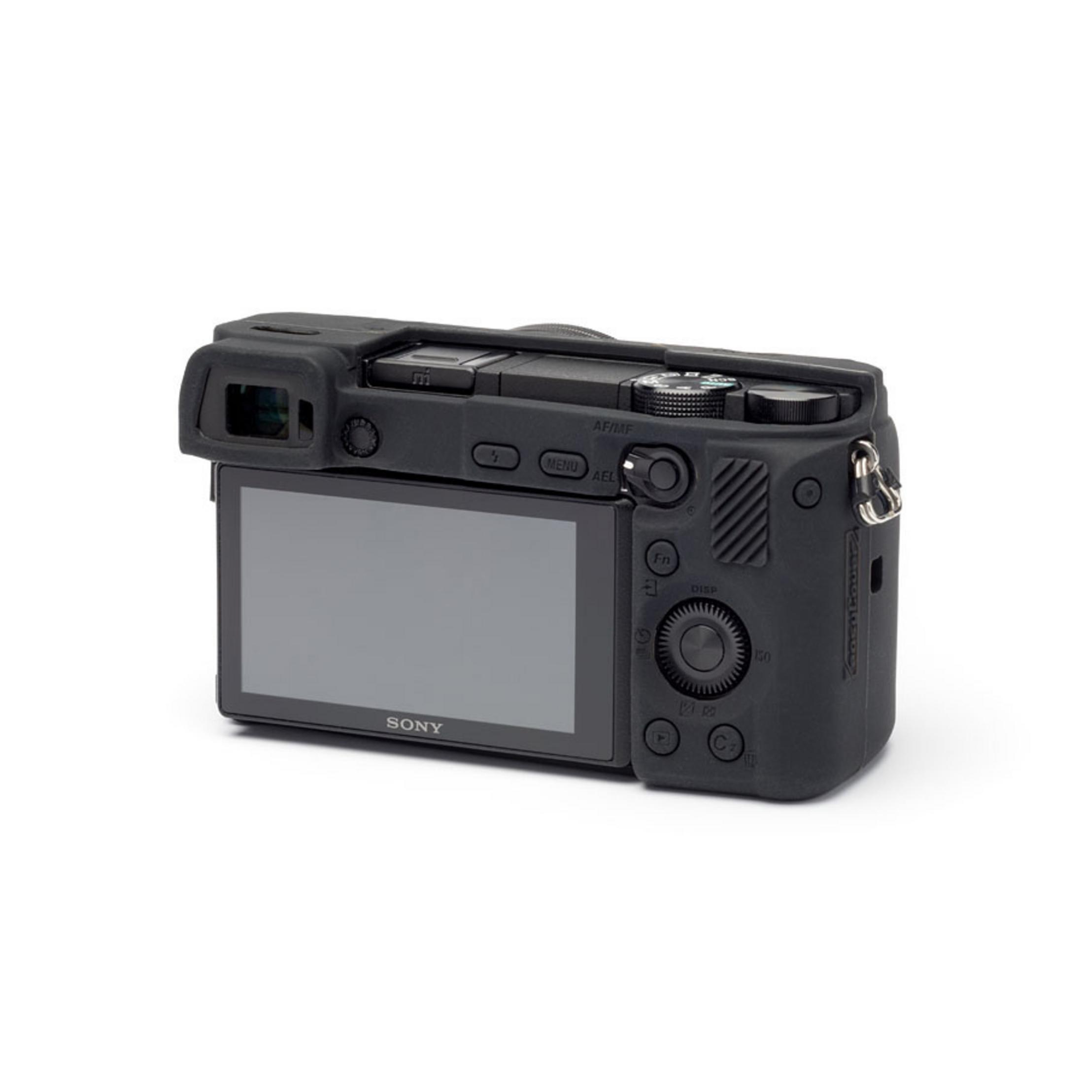 Black Sony camera body with silicone case, rear view with LCD screen.