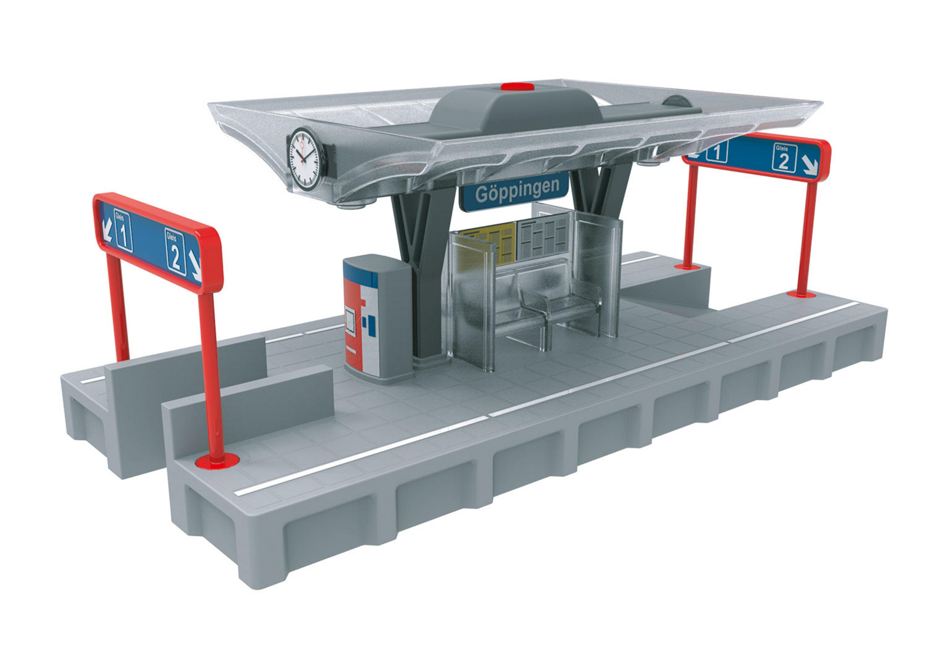 Eine Spielzeug-Bahnstation mit Sitzbänken, Schildern und Uhr.