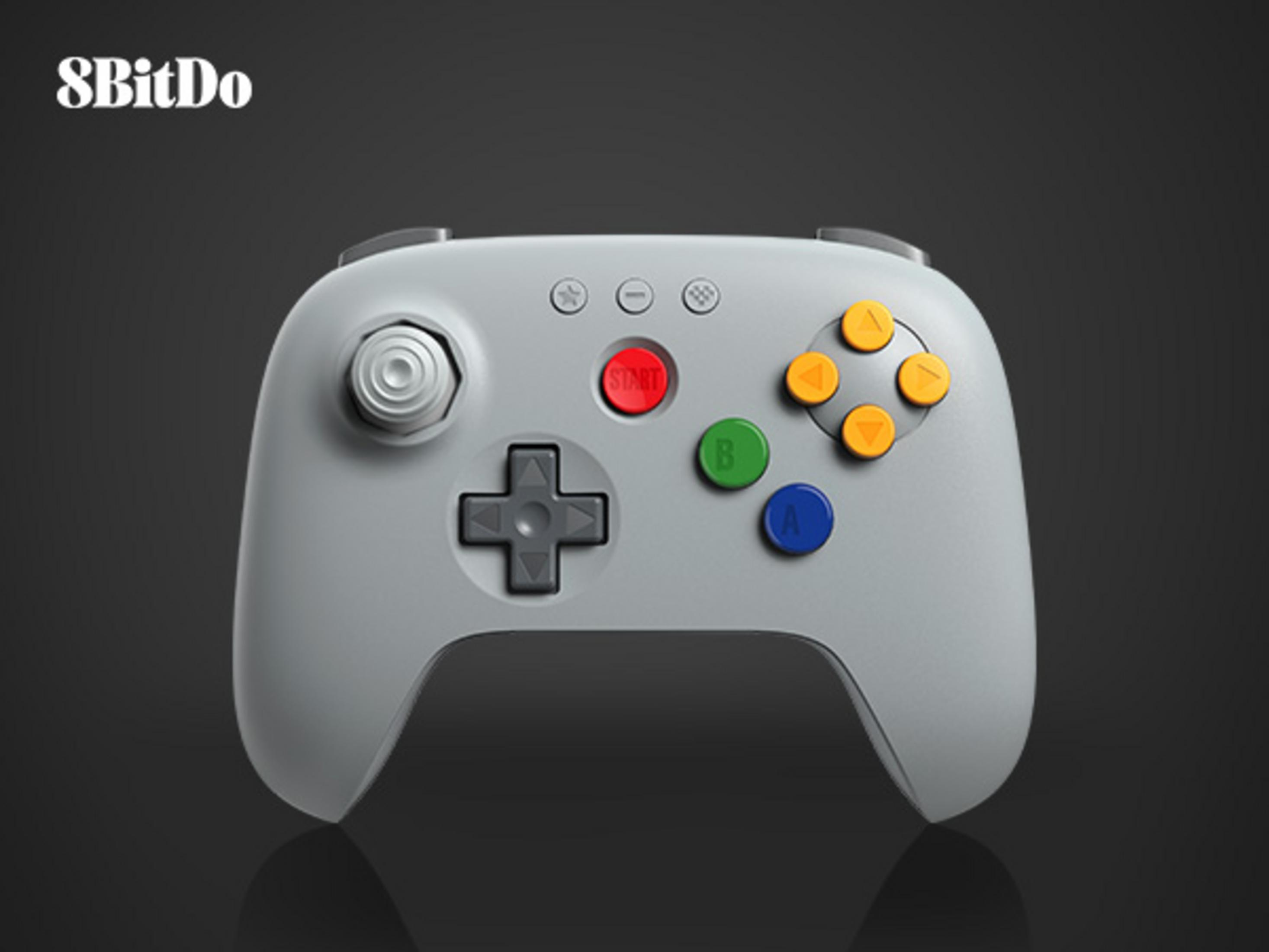 Ein grauer 8BitDo Controller mit gelben, roten, grünen und blauen Knöpfen.