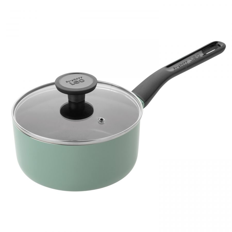 A light green saucepan with a glass lid and black handle.