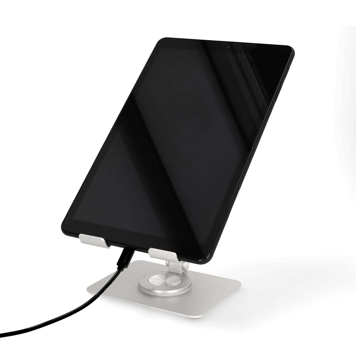 A black tablet on a silver stand, connected by a cable.