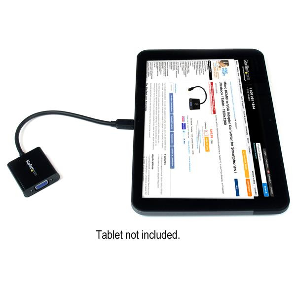 Una tableta está conectada por cable a un adaptador negro.