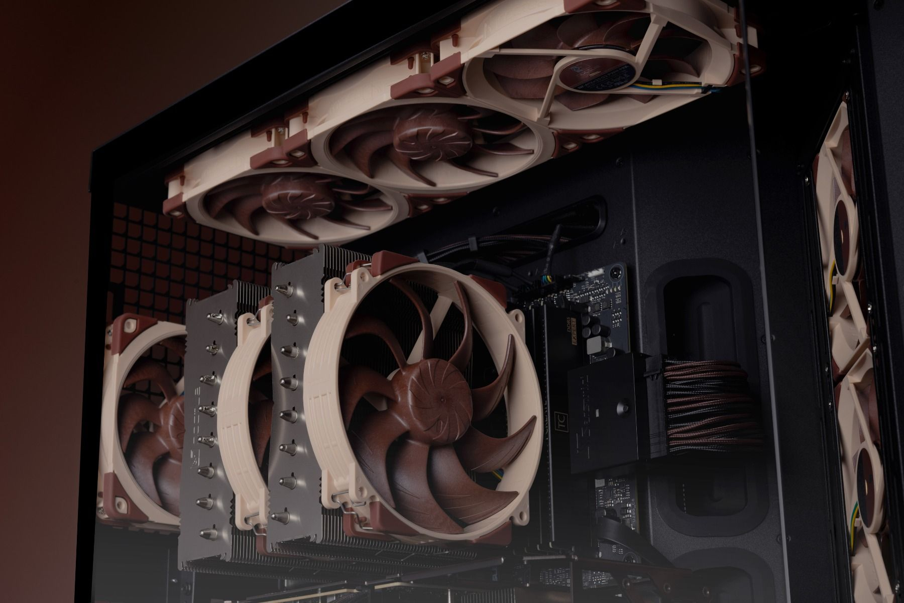 Computer case with brown and beige fans and CPU coolers.