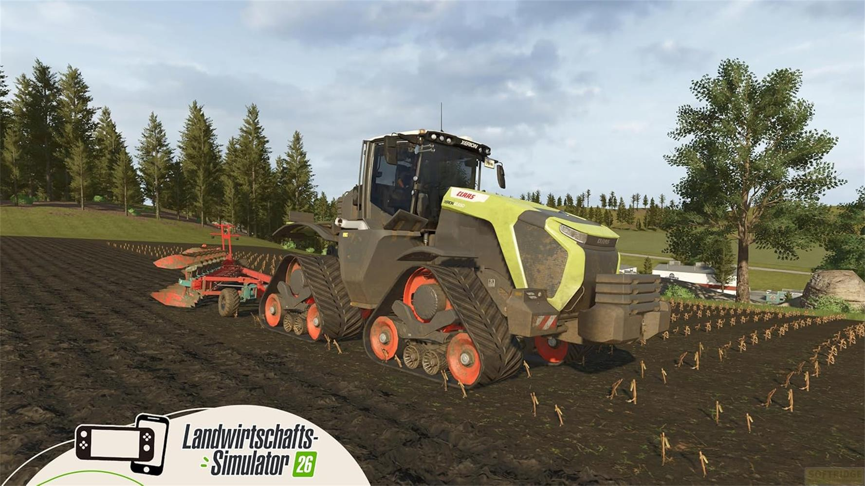 Ein gelber Claas-Traktor mit Ketten fährt über ein Feld, neben ihm ein roter Pflug.