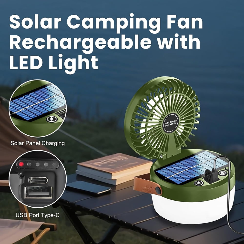 Grüner Campinglüfter mit Solarpanel und LED-Licht auf einem Tisch.