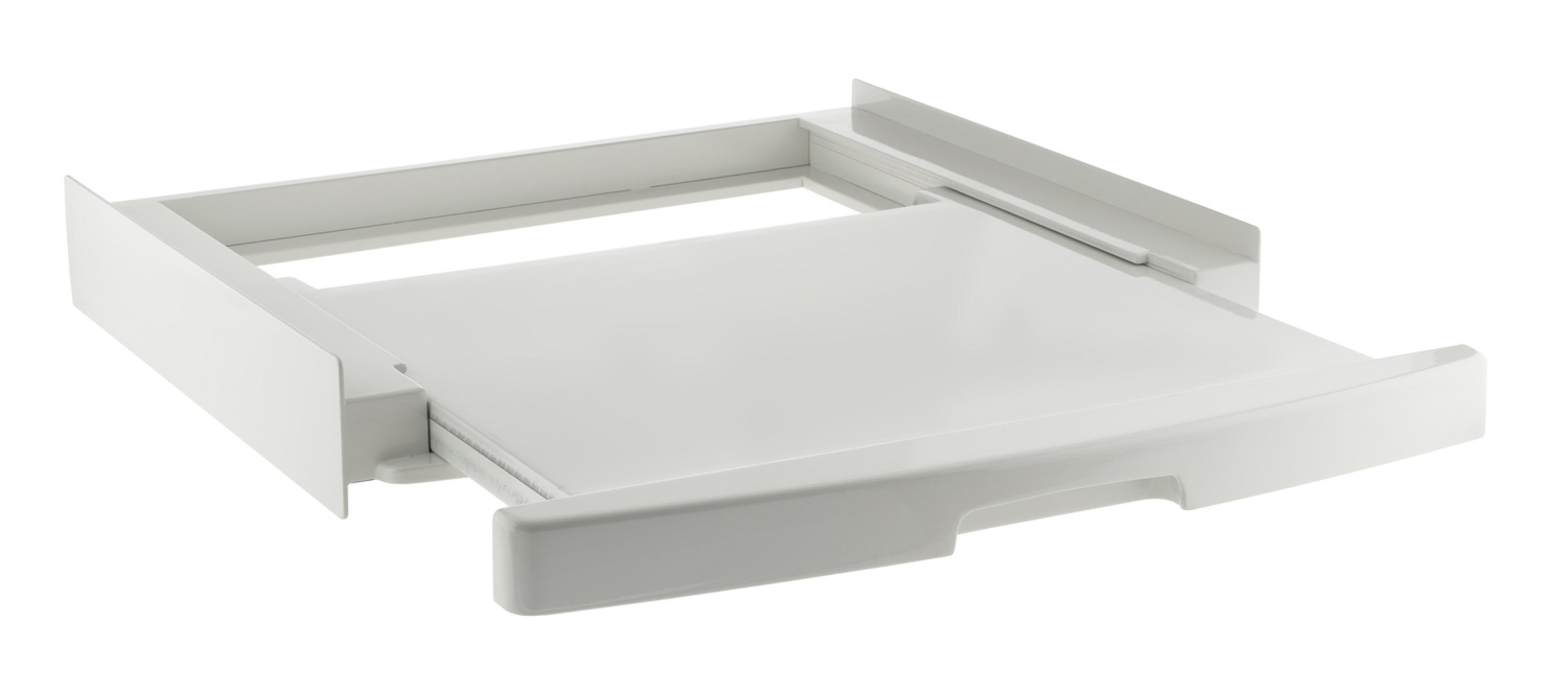 Un marco de cajón blanco extraíble para una lavadora.