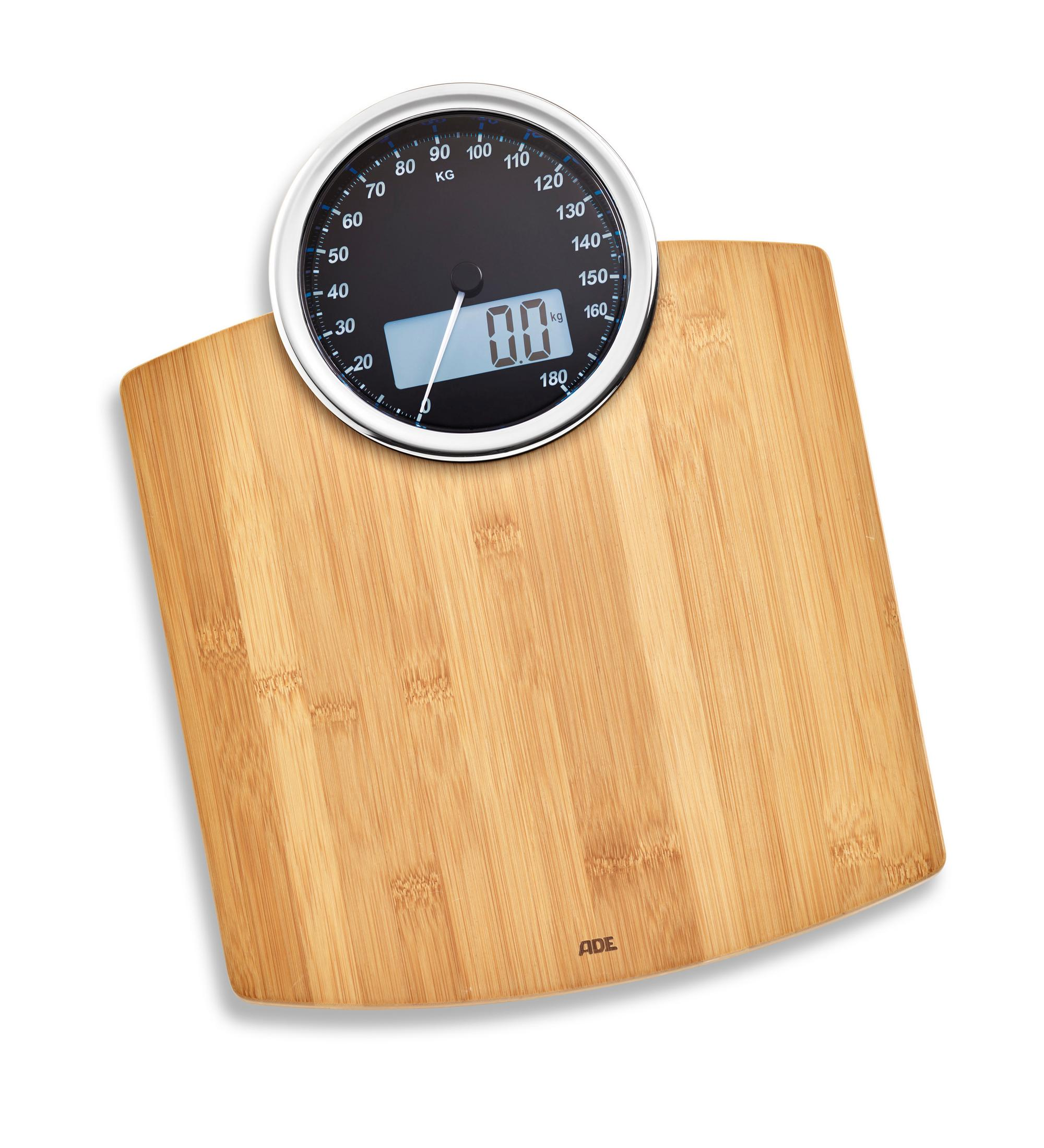 Eine Waage mit Holzoberfläche und rundem Zifferblatt zeigt 0,0 kg an.