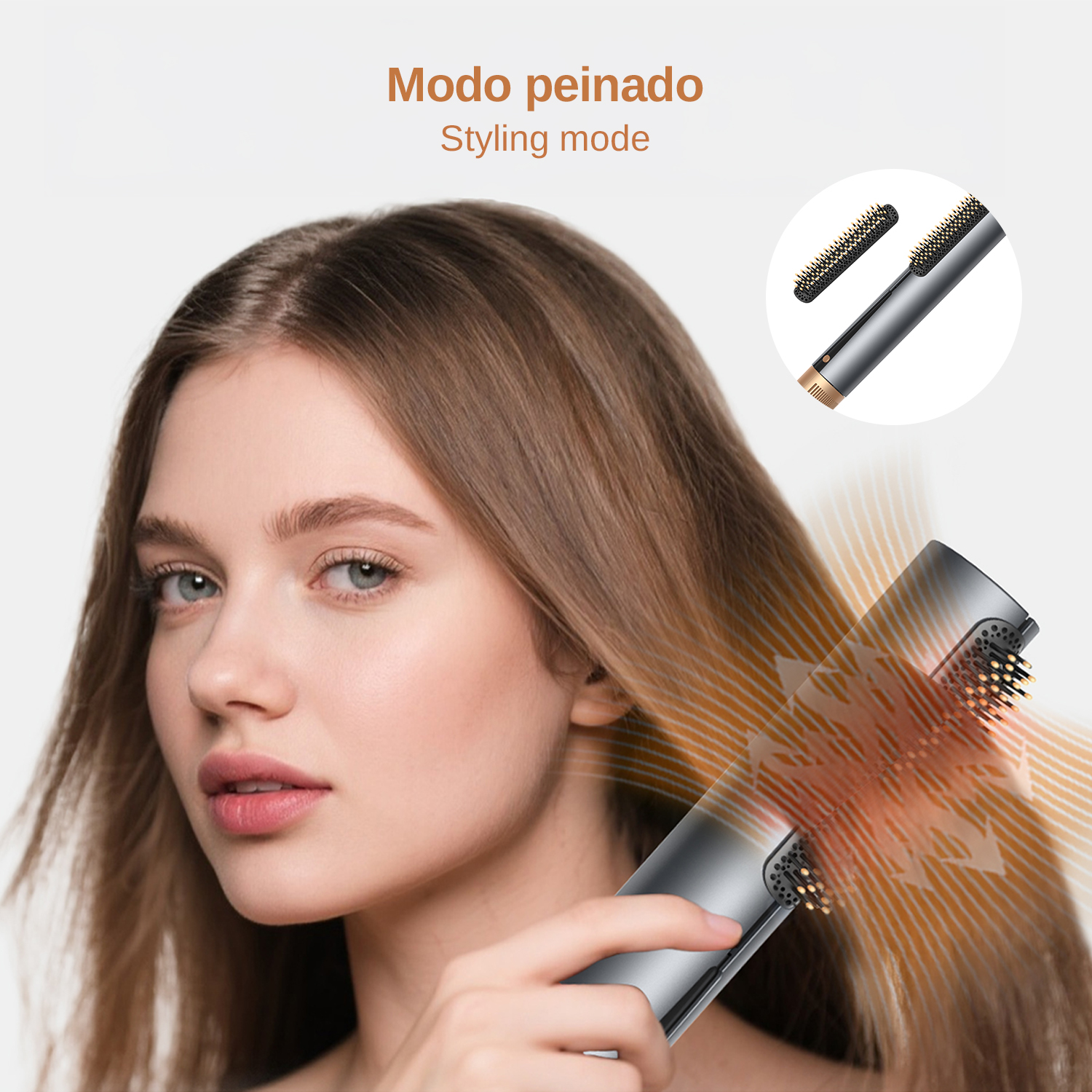 Una donna si acconcia i capelli castani con un asciugacapelli argentato che emette aria calda.
