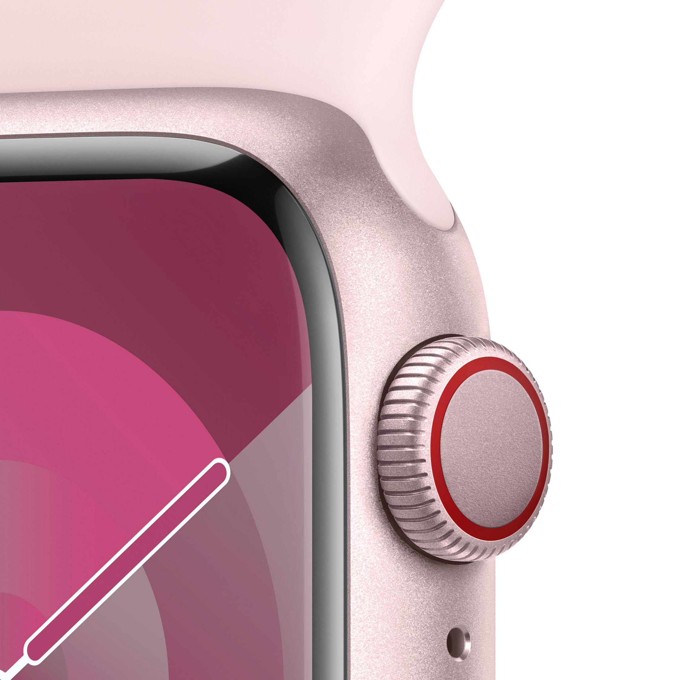 Primo piano di uno smartwatch color oro rosa con corona digitale e anello rosso.