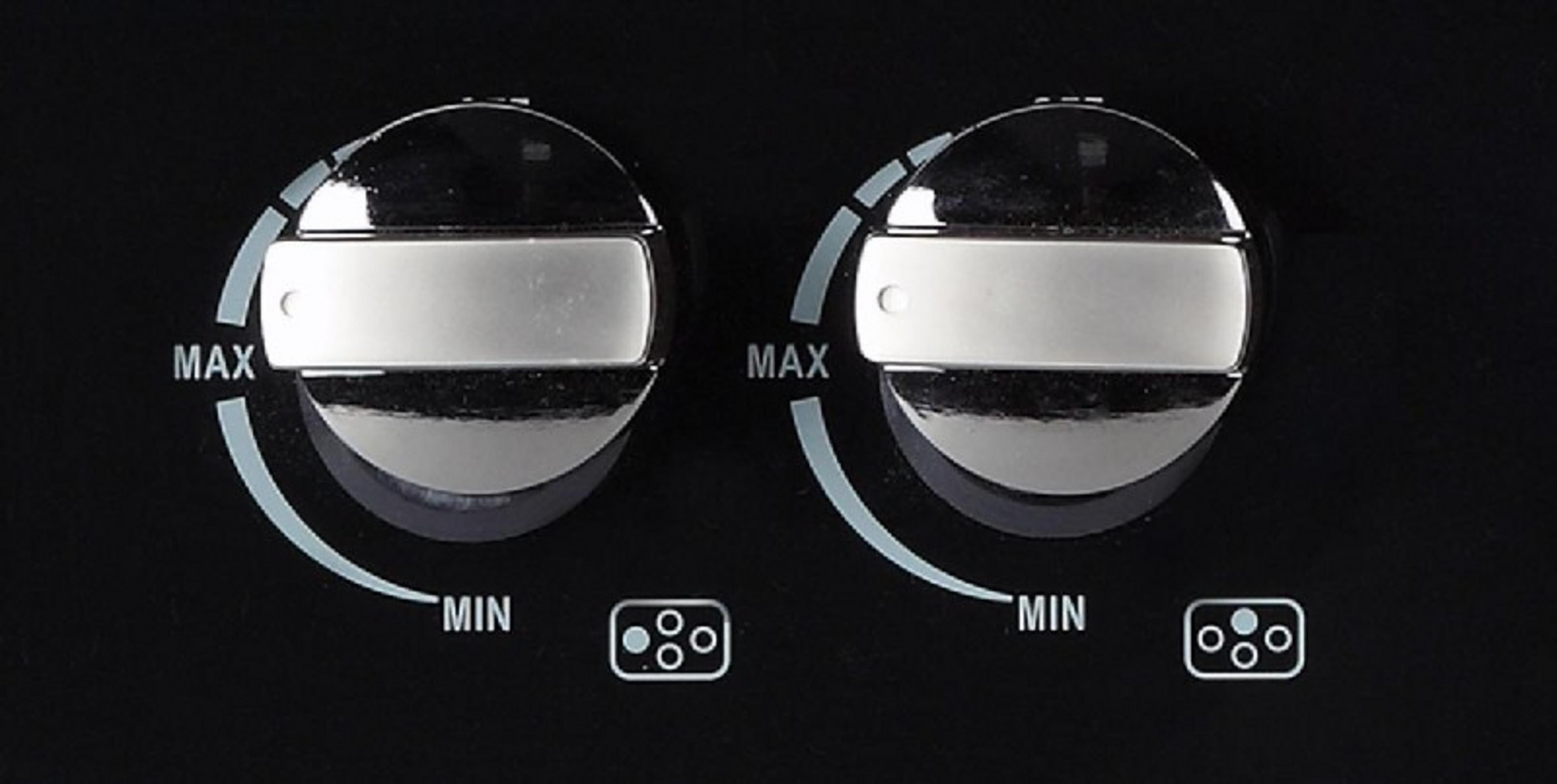 Dos dial giratorios brillantes con marcas min/max y símbolos de zona.