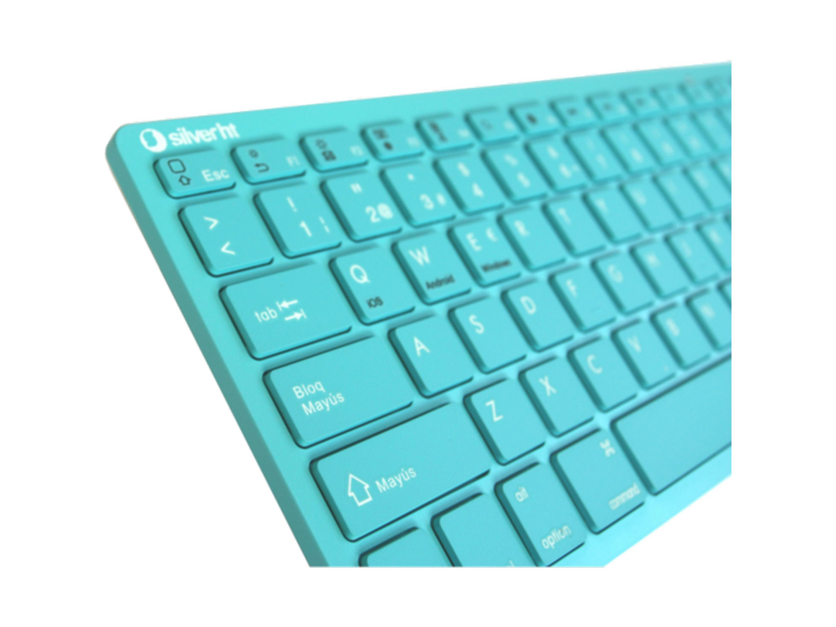 Un primer plano de un teclado turquesa con leyendas de teclas blancas.