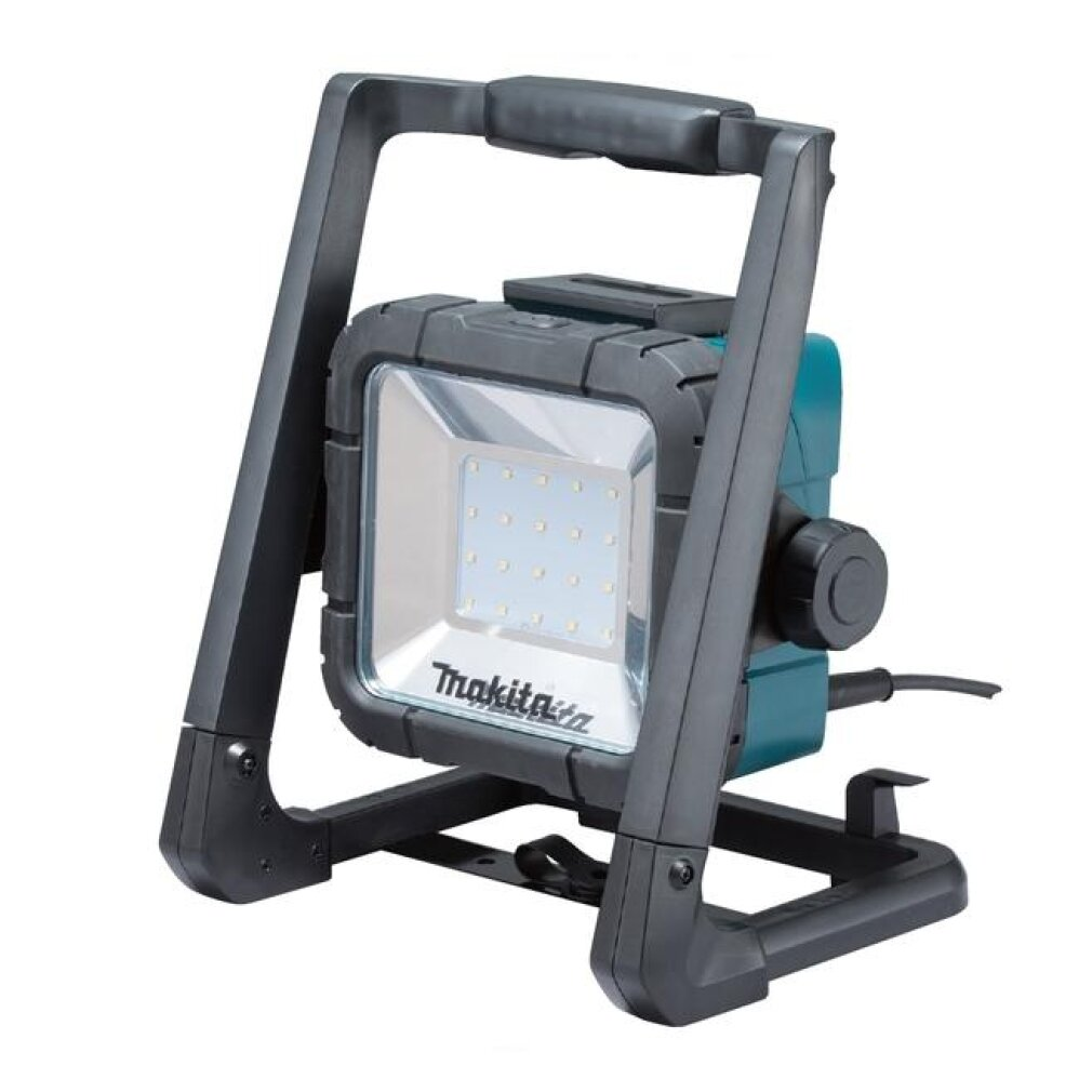 Una luz de trabajo LED portátil Makita negra y azul verdoso con marco robusto.