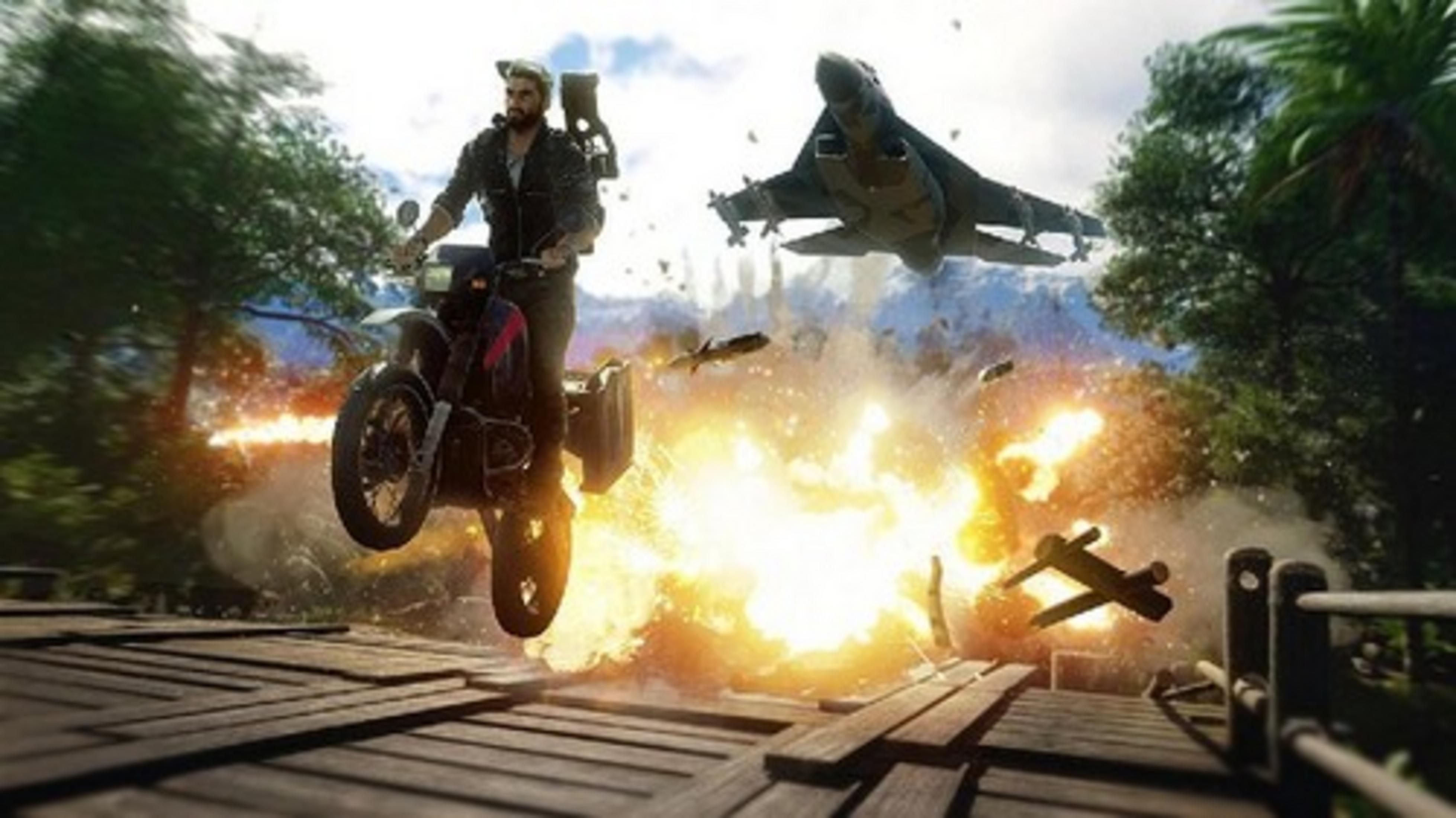 A man on a motorcycle jumps over an explosion, a jet flies in the background.