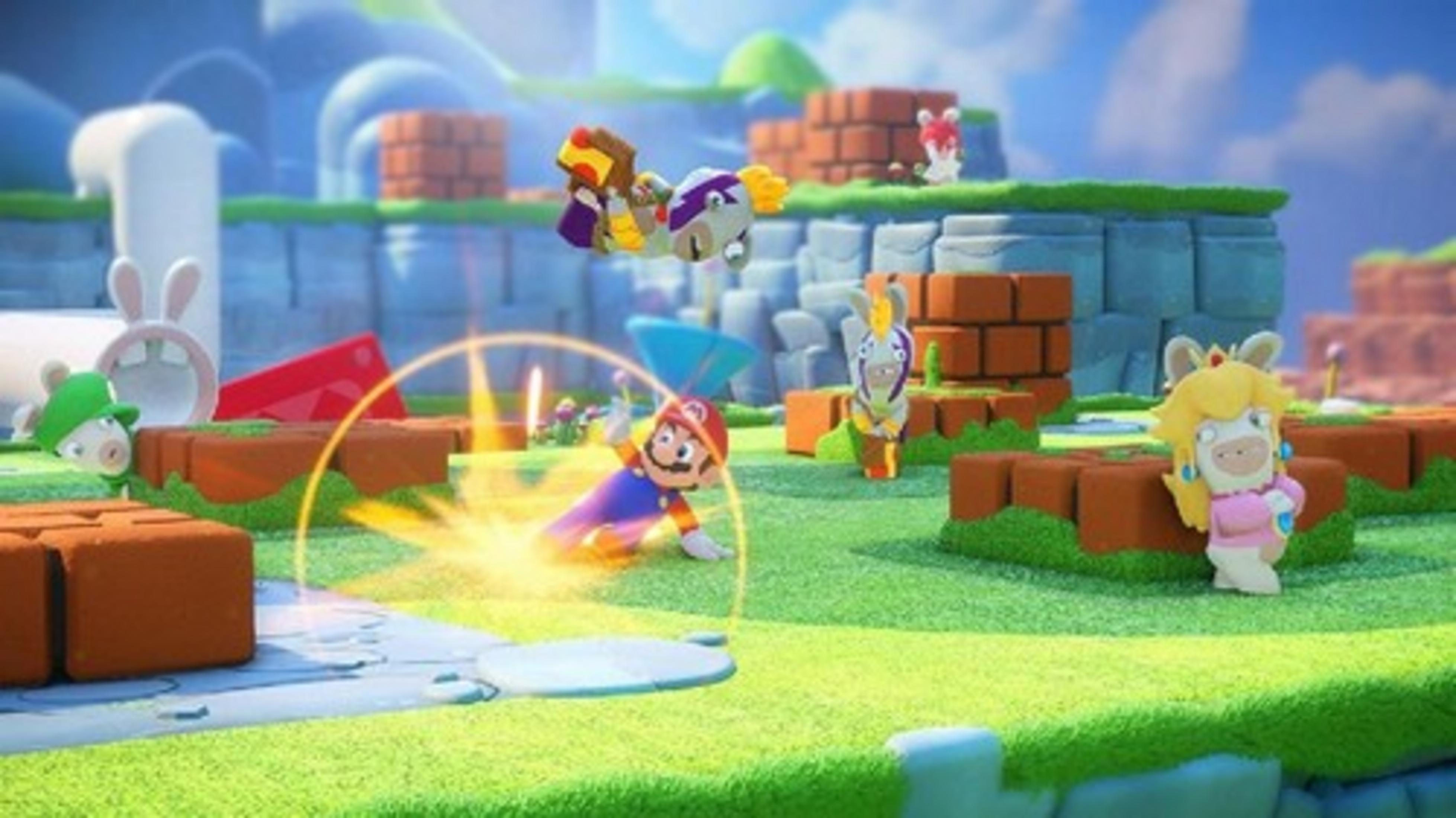Mario y Rabbids en combate en un campo verde con bloques de ladrillo.