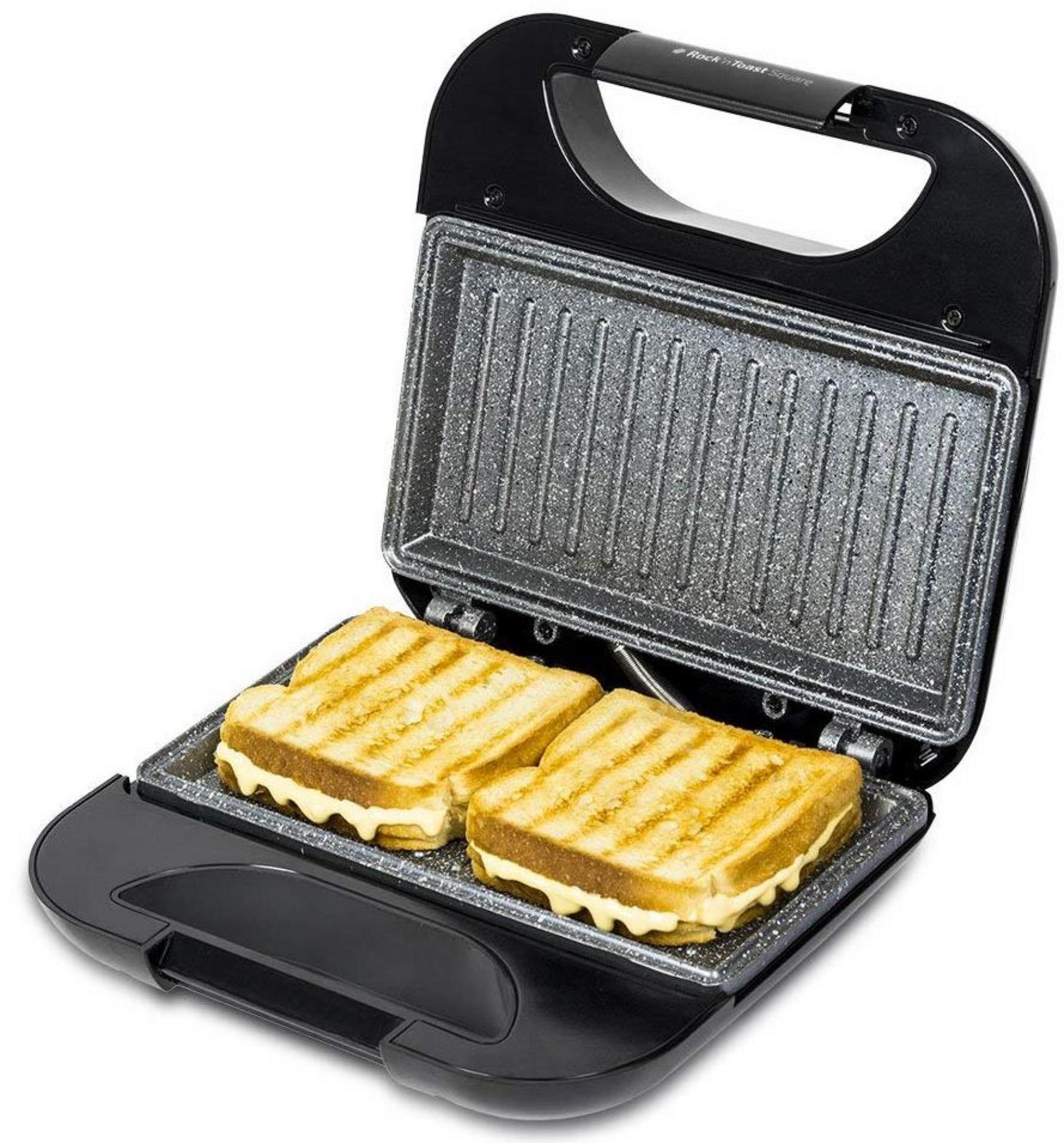 Un tostapane aperto con due toast grigliati e formaggio fuso.