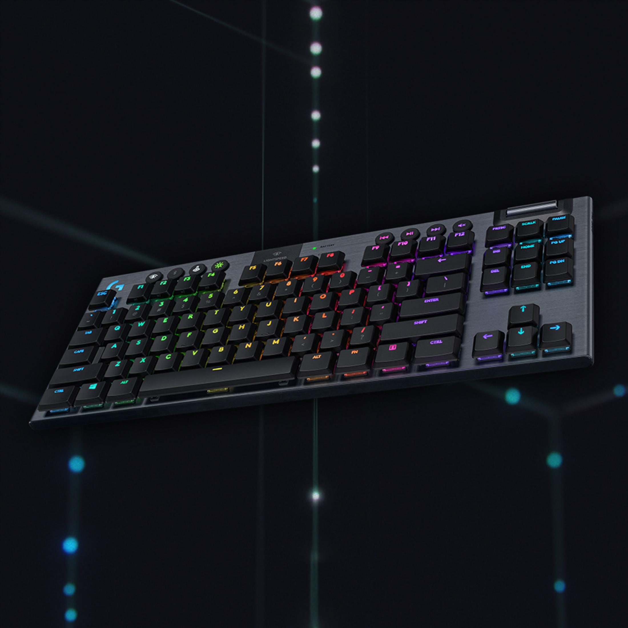 A black keyboard with RGB lighting on a dark background.