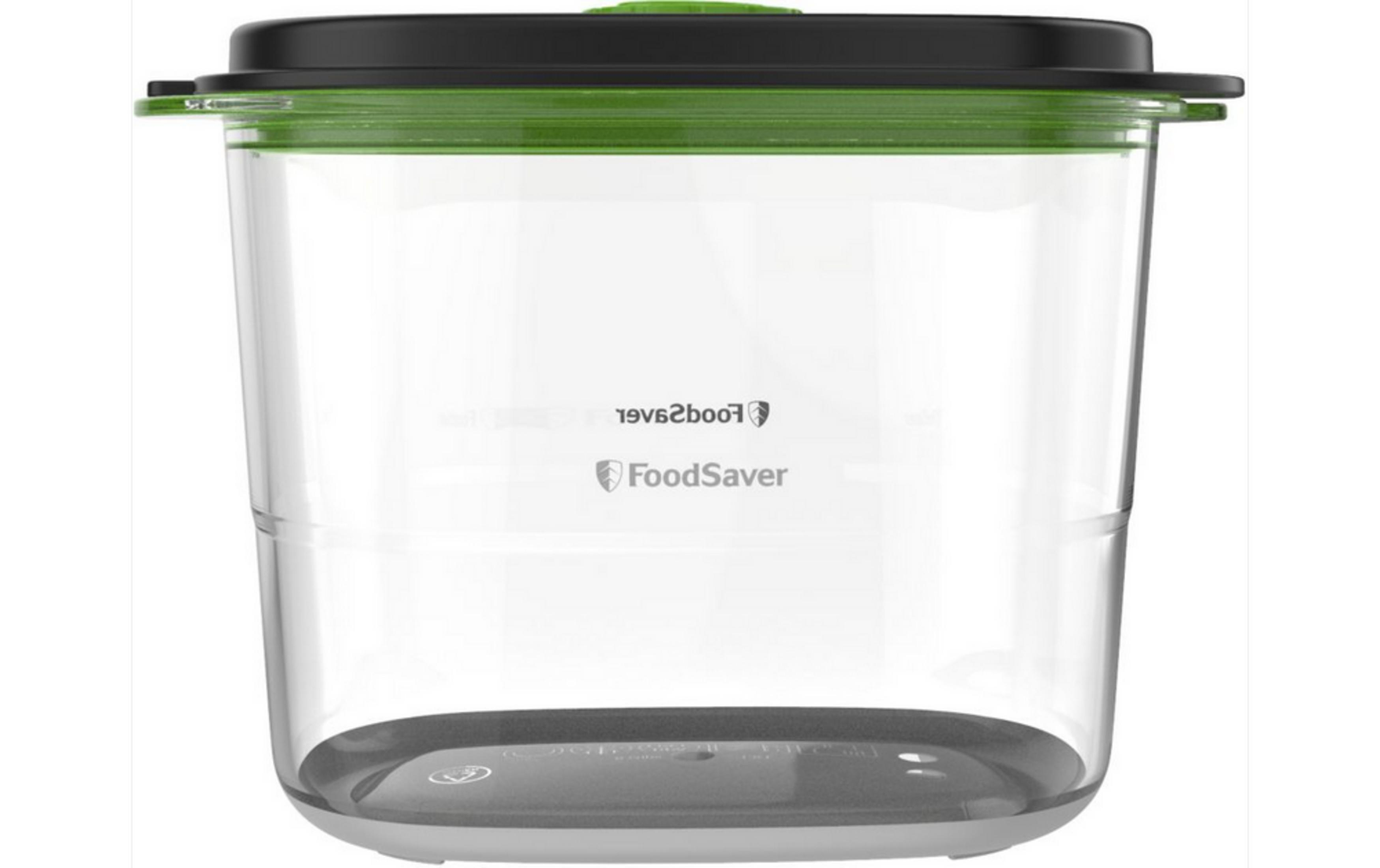 Un recipiente de vacío transparente con tapa negra y anillo verde.