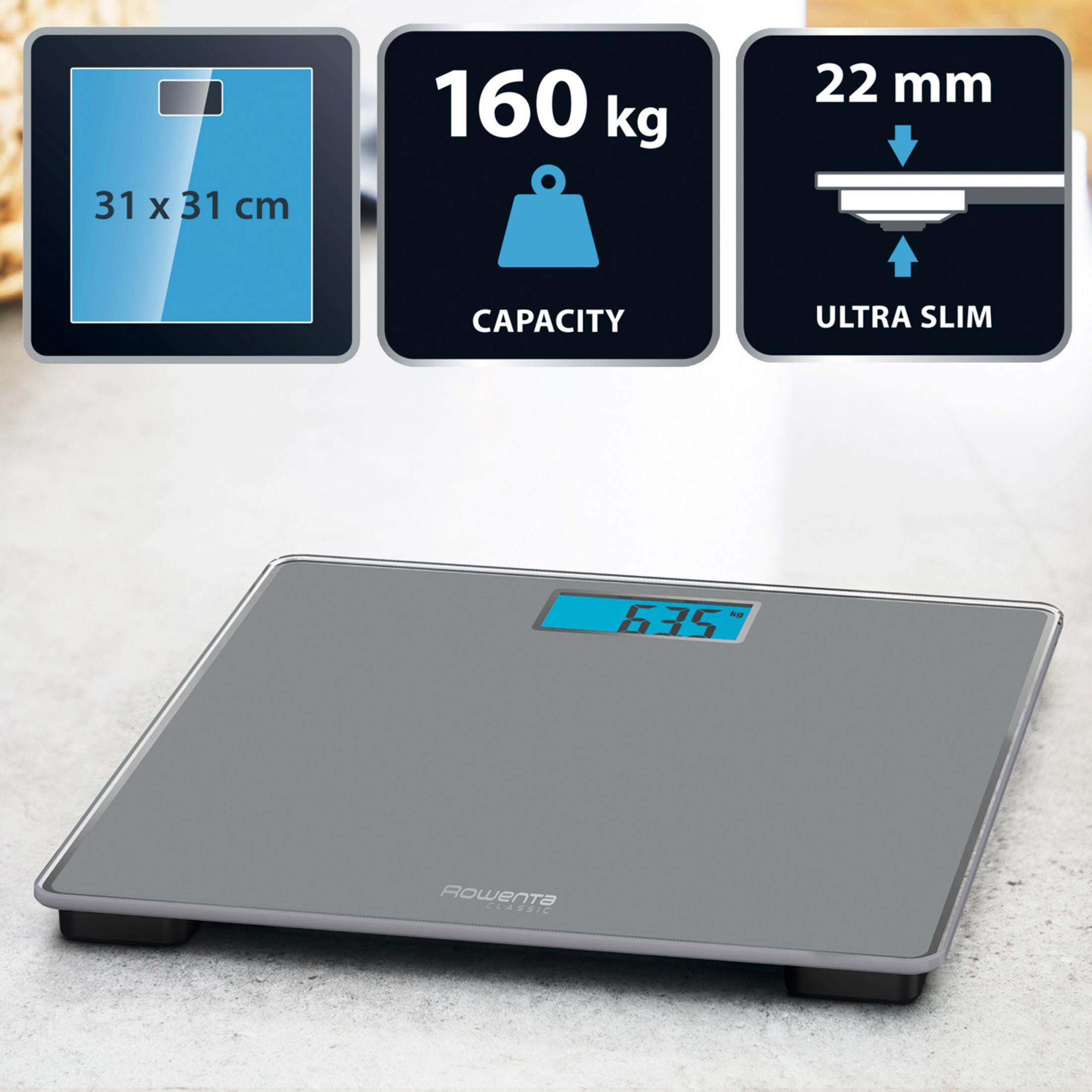 Balanza digital gris con pantalla LCD azul que muestra 63,5 kg.